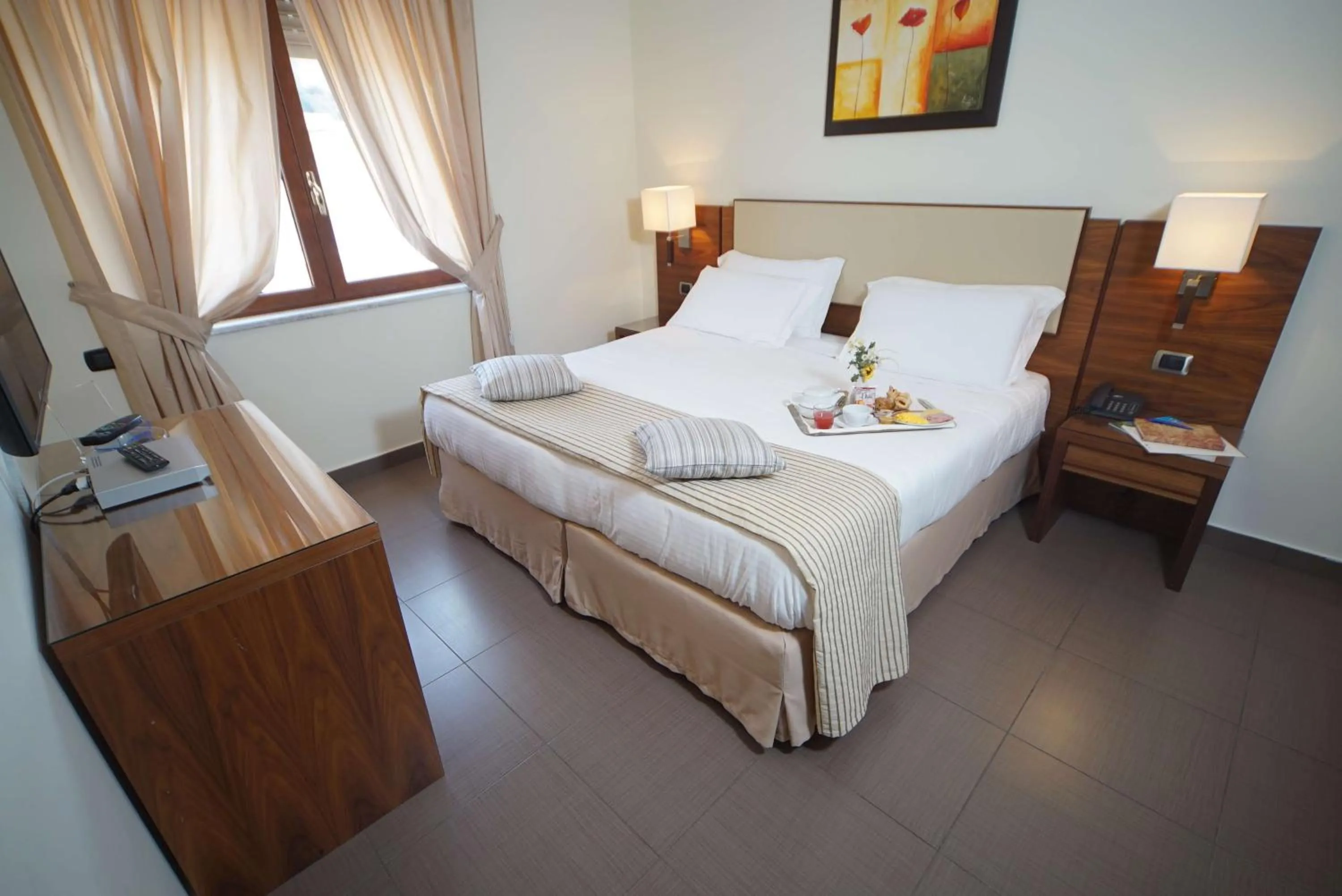 Bed in Suites & Residence Hotel