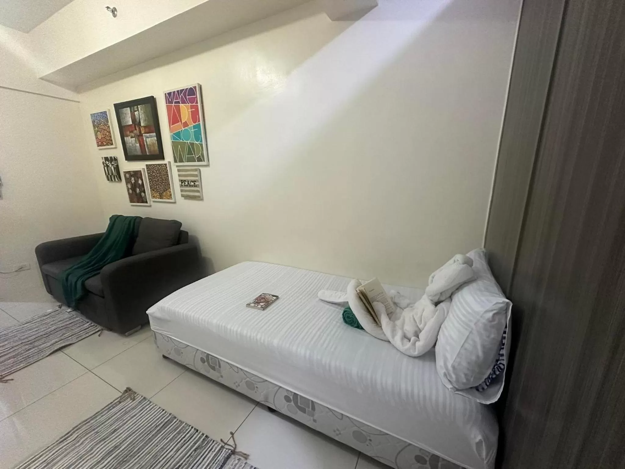 Bed in Green Residences Stays by PBYY