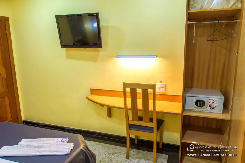 Photo of the whole room, TV/Entertainment Center in Capri Hotel