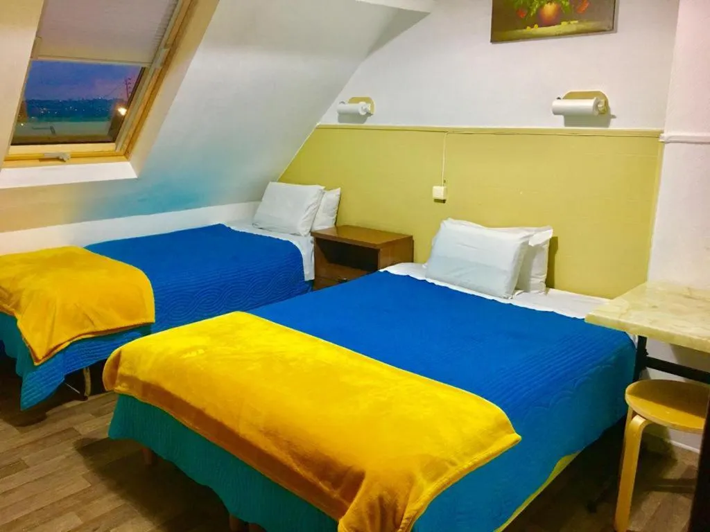 Bed in Hotel Paris Star