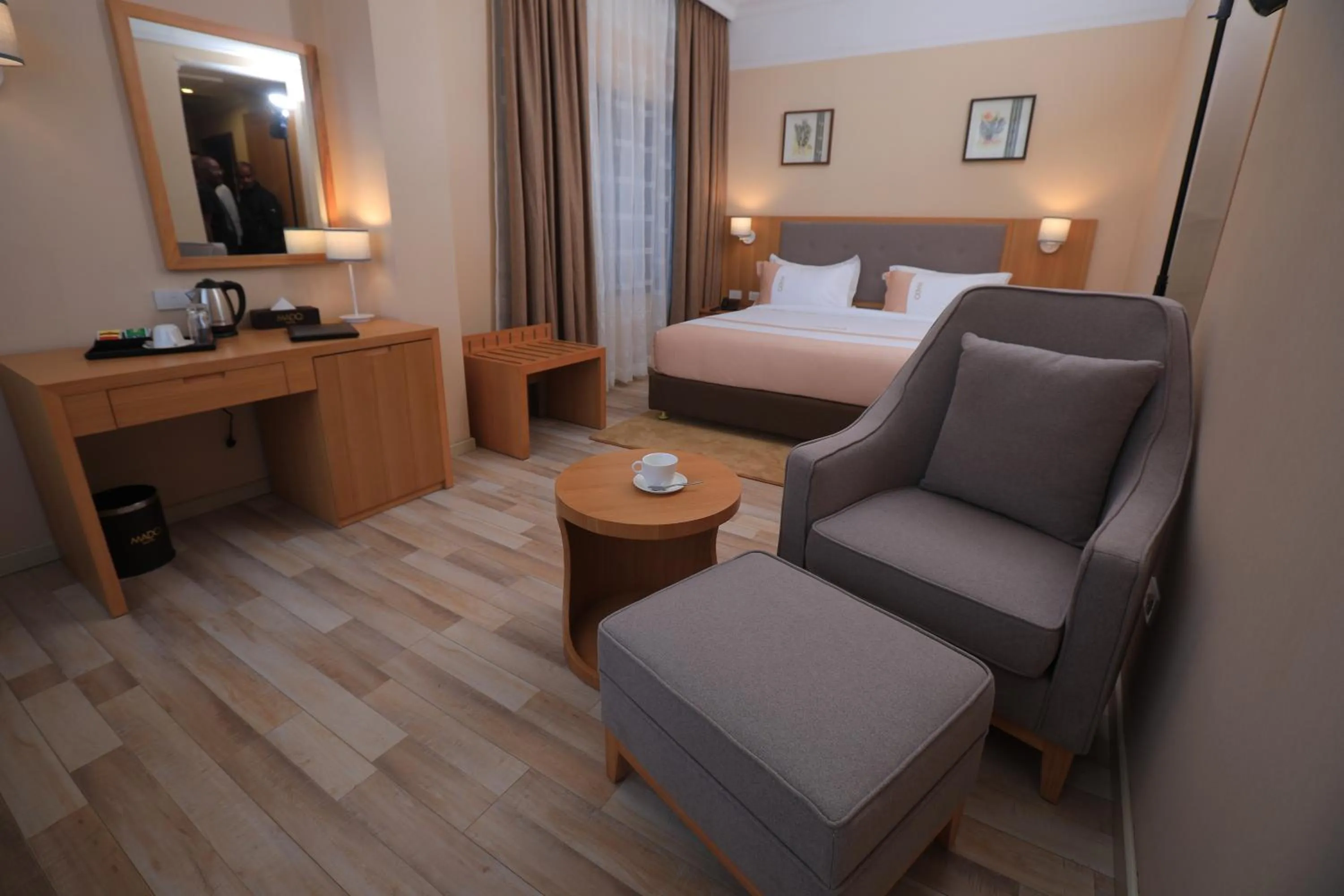 Living room, Bed in Mado Hotel