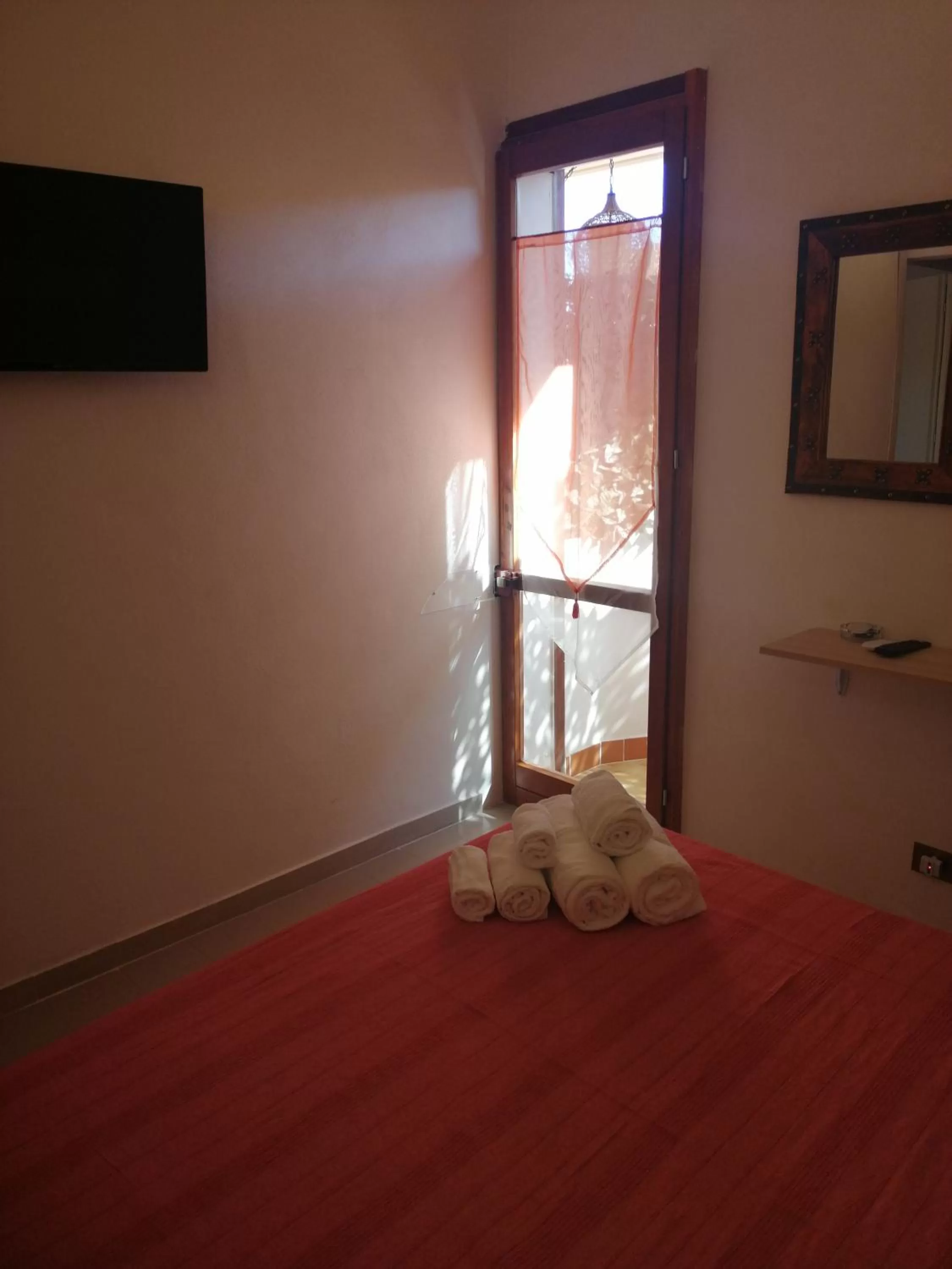 Bed in Le Rocce Holiday Rooms