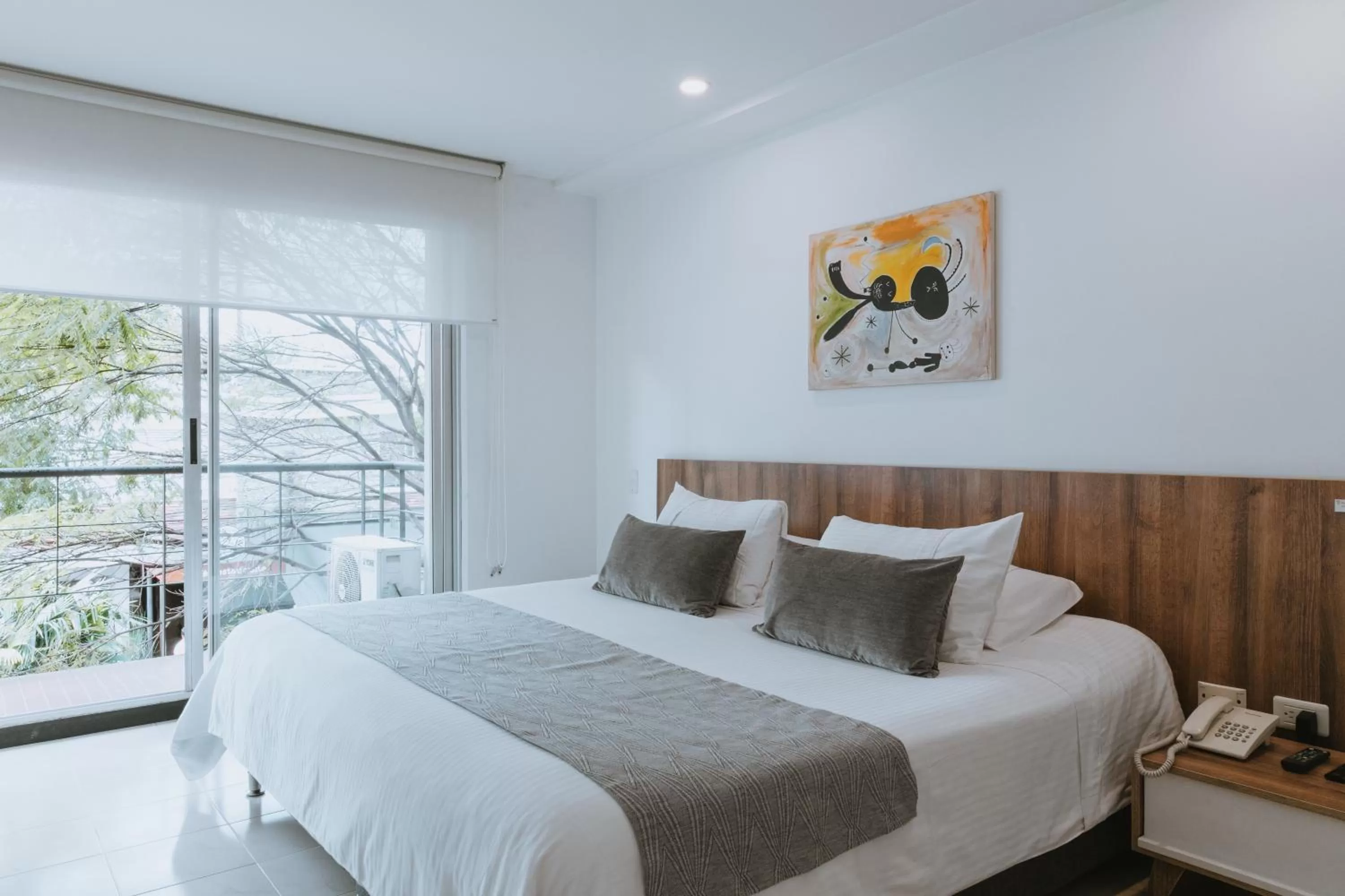 Bedroom, Bed in Travelers Orange Suites