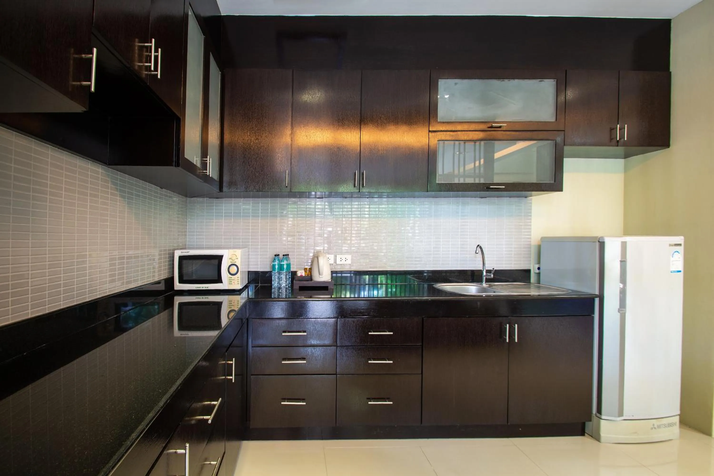 Kitchen or kitchenette in Peach Blossom Resort & Pool Villa - SHA Plus