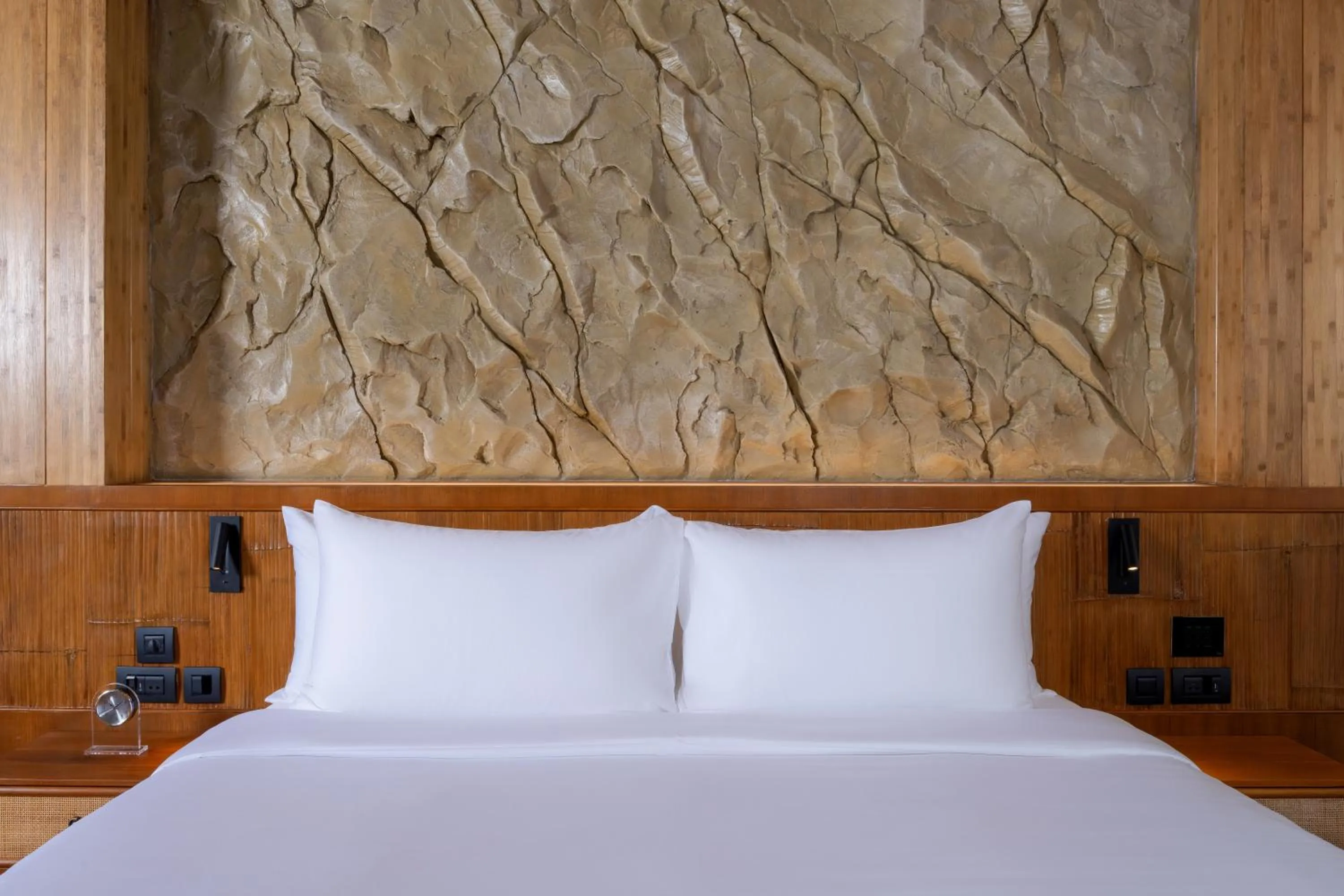 Bed in SINAE Phuket Luxury Hotel