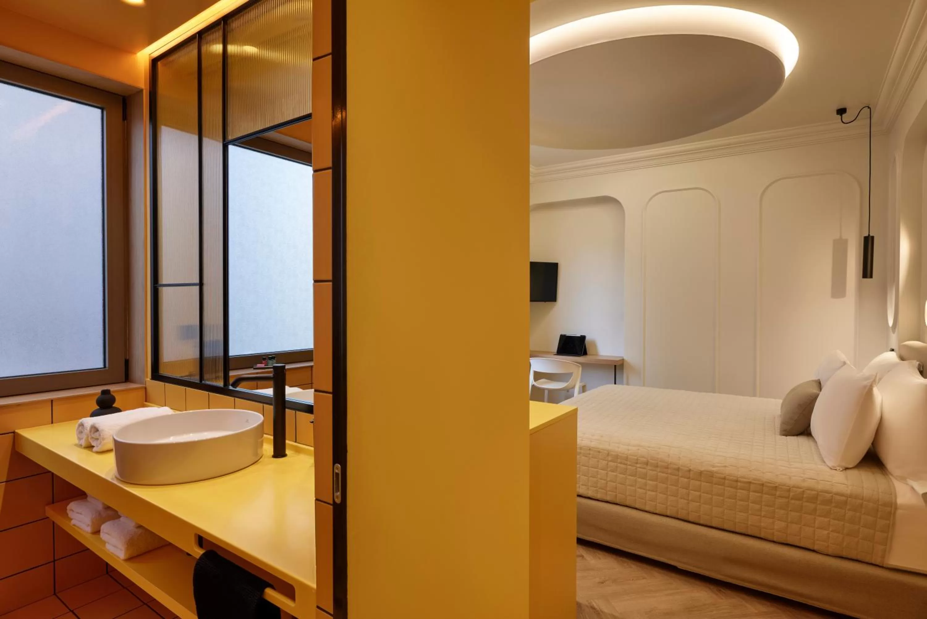 Bed in DWELL - Elegant City Stay