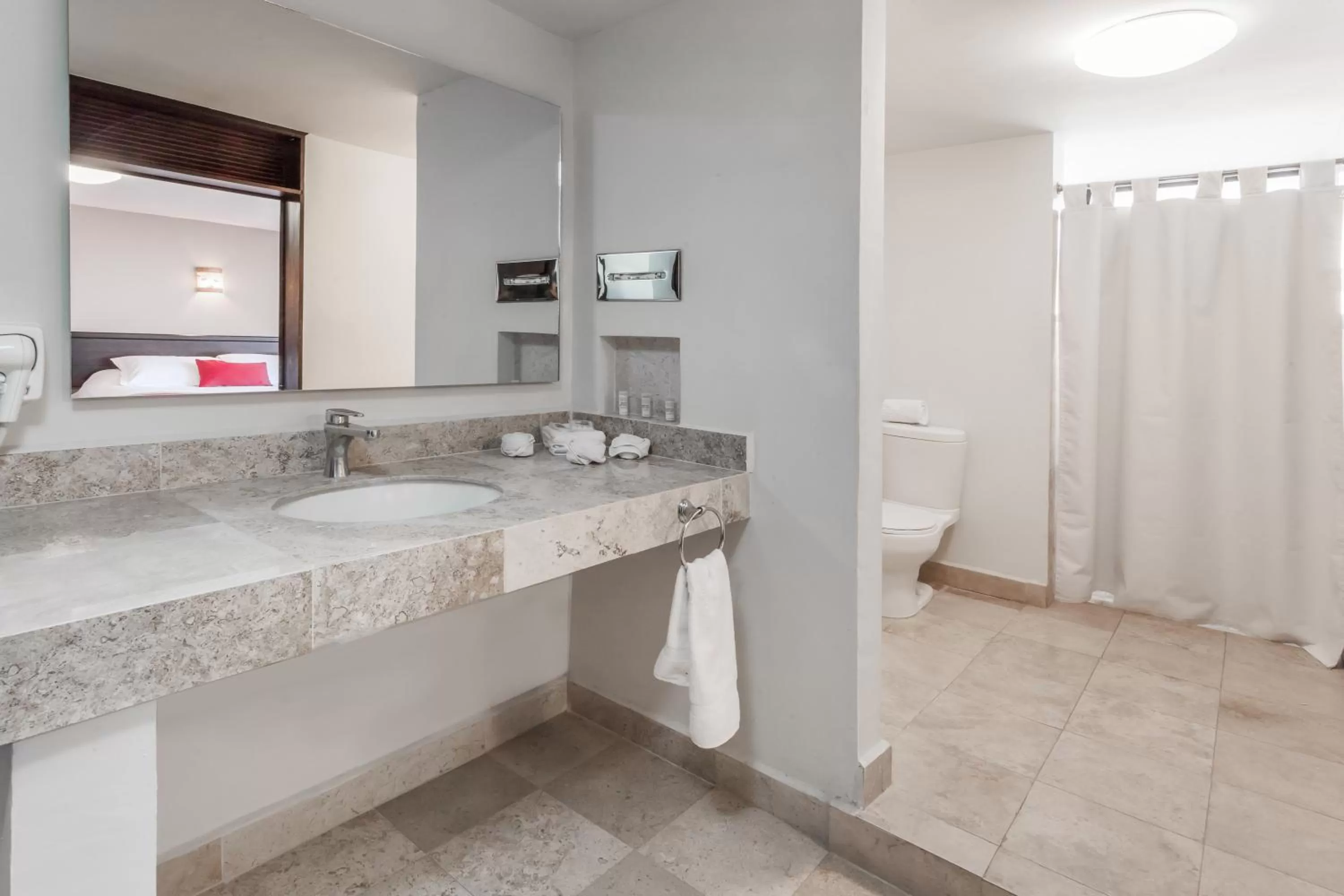 Bathroom in Ramada Plaza by Wyndham Leon