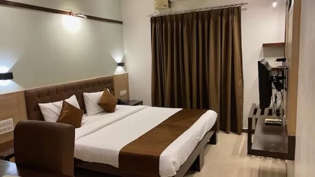 Bed in Hotel Plaza Heights by RAK Rooms, Mangaluru