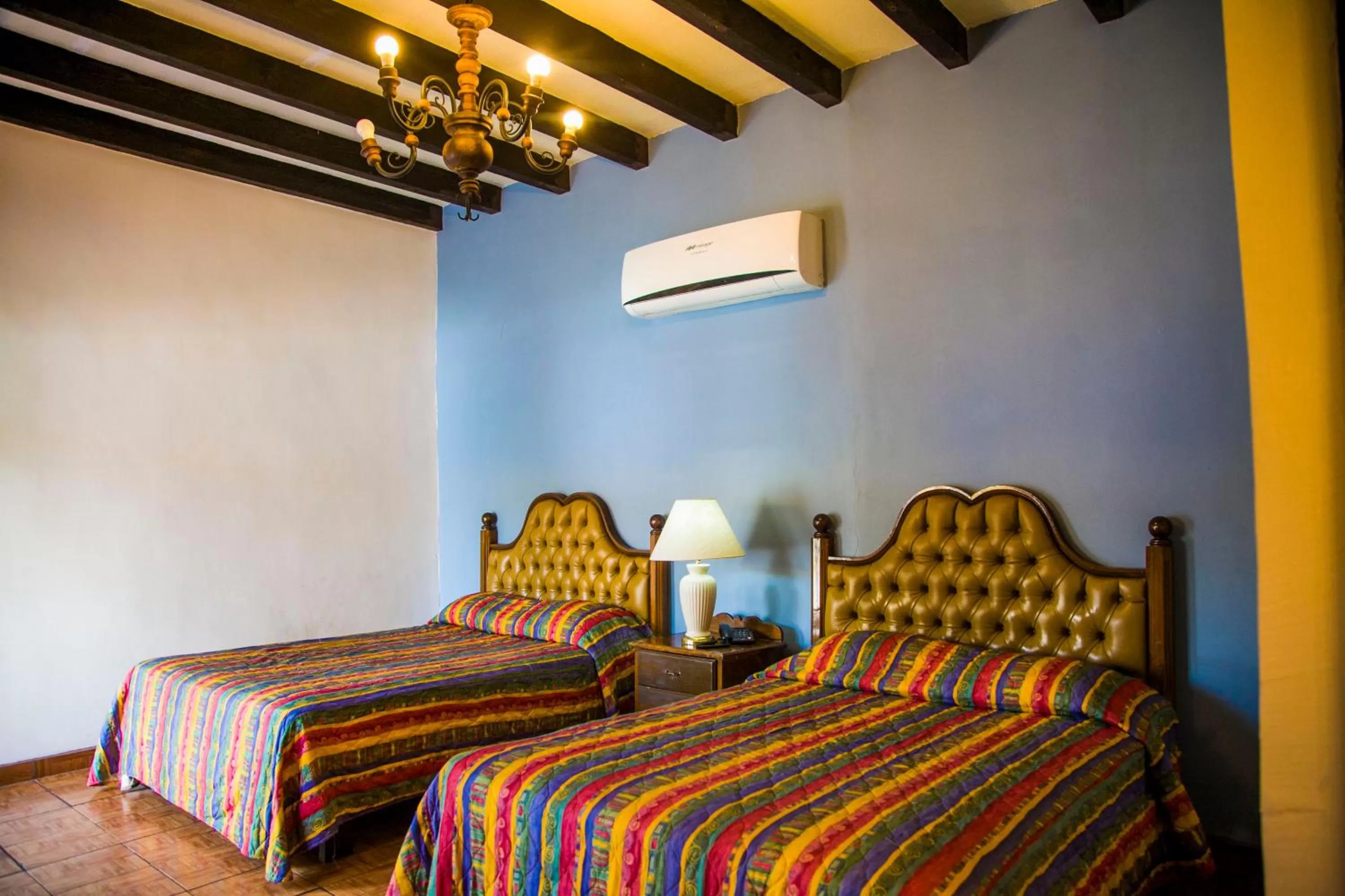 Bed in Hotel Cosmos Don Carlos