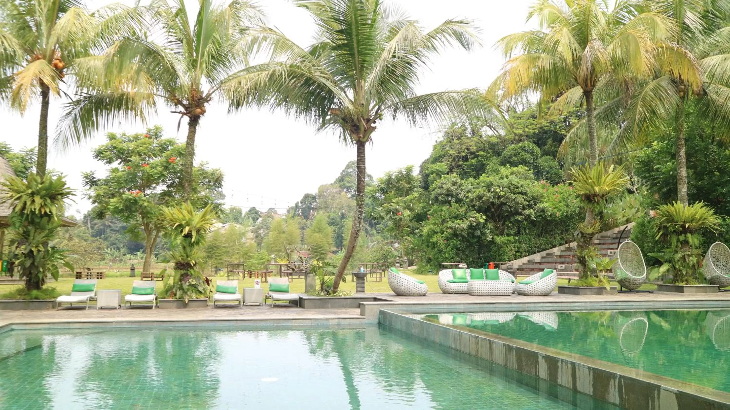 Swimming pool in Amanuba Hotel & Resort Rancamaya