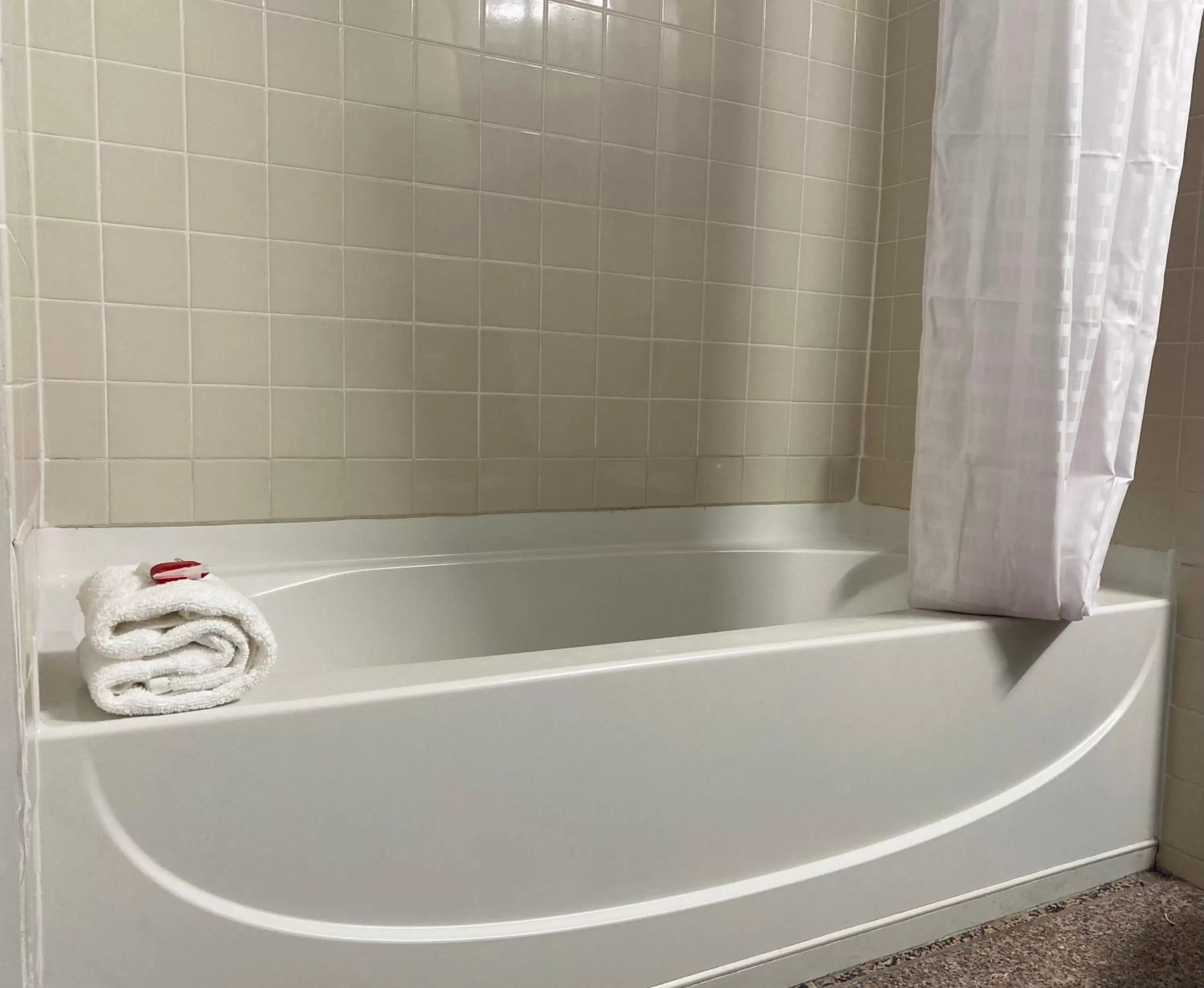 Bathroom in Ramada by Wyndham Hartford North - Bradley Airport