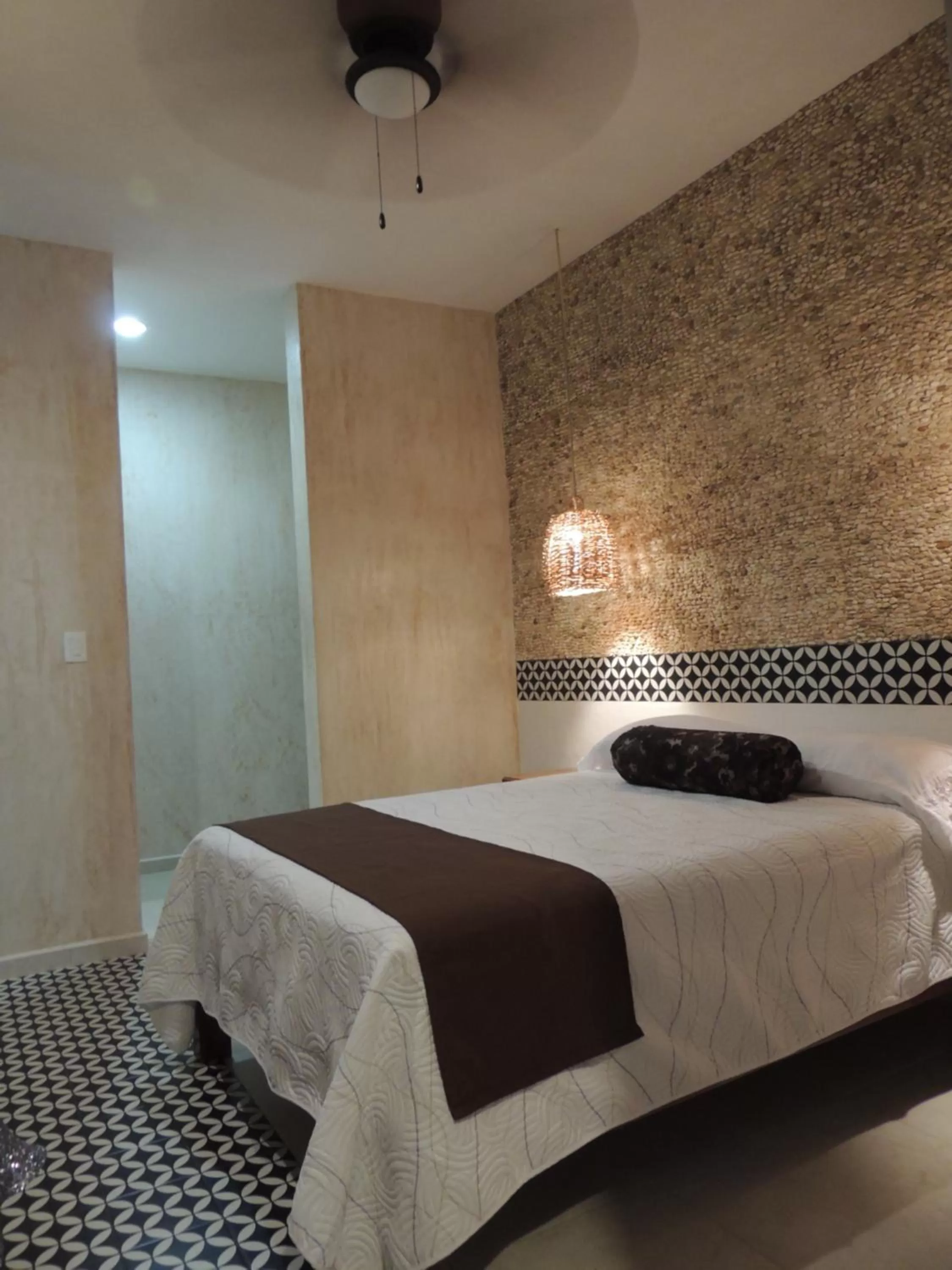 Bed in Hotel Boutique Bugambilias