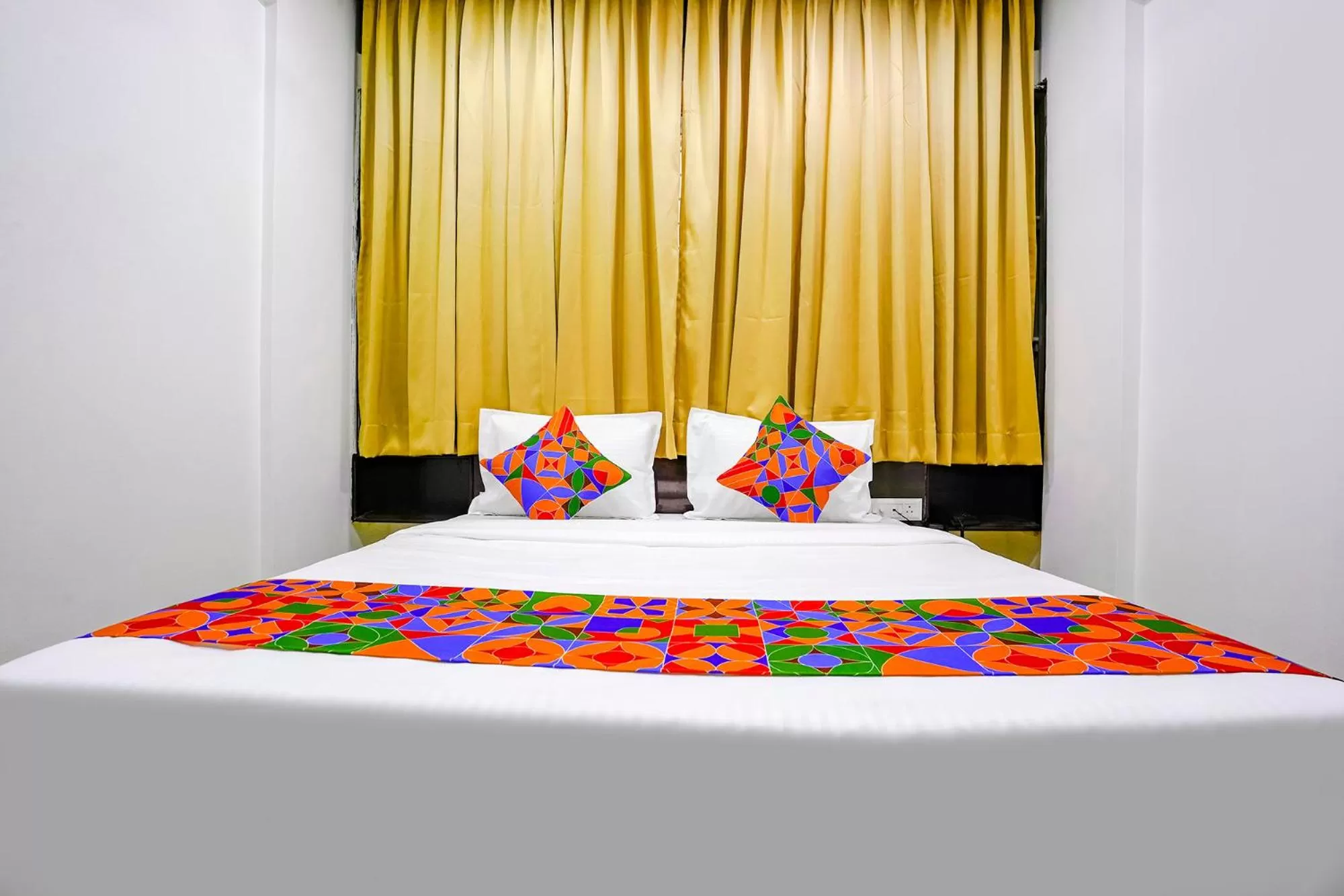 Bed in FabHotel Woods Regency