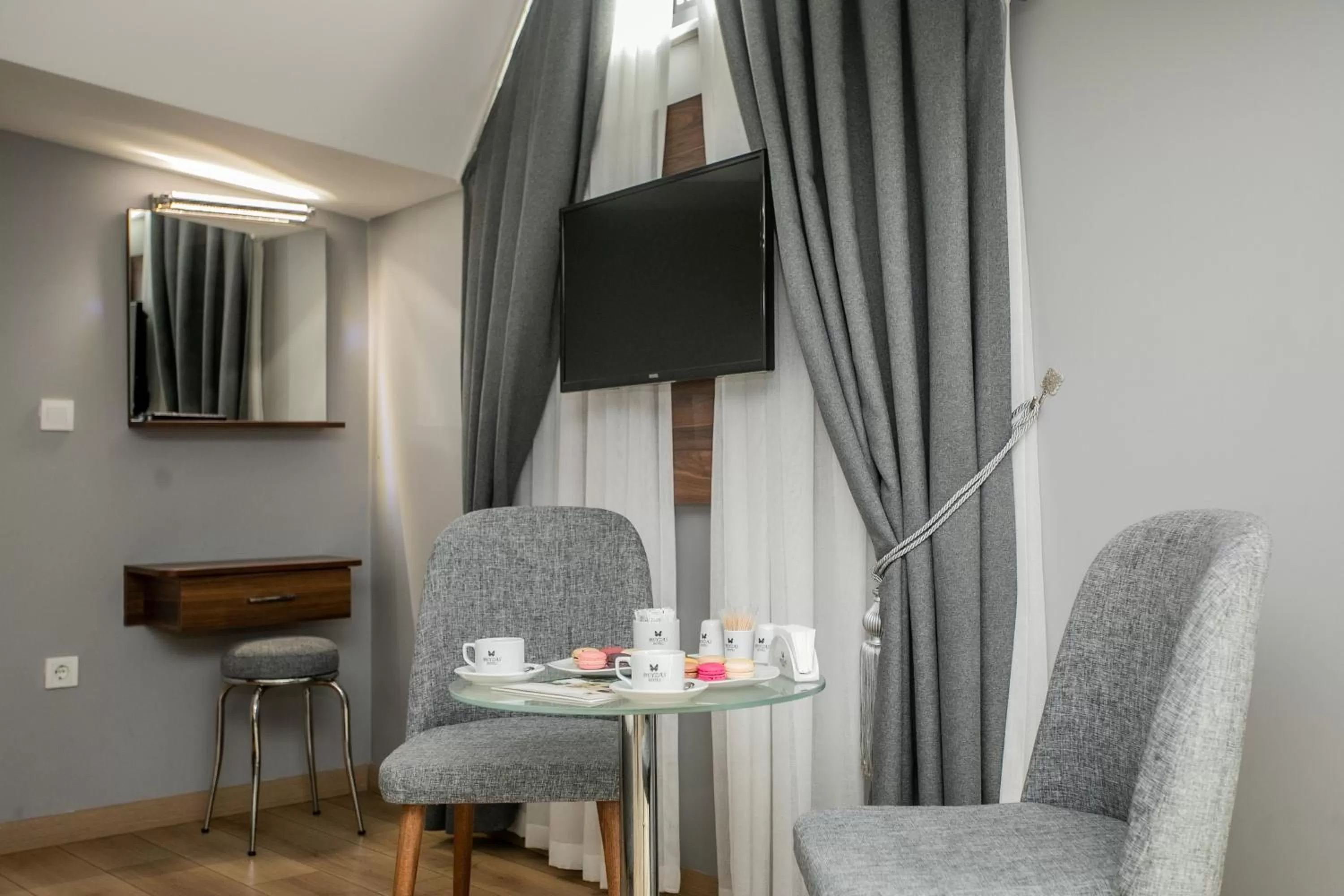 TV and multimedia, TV/Entertainment Center in Beyzas Hotels & Suites