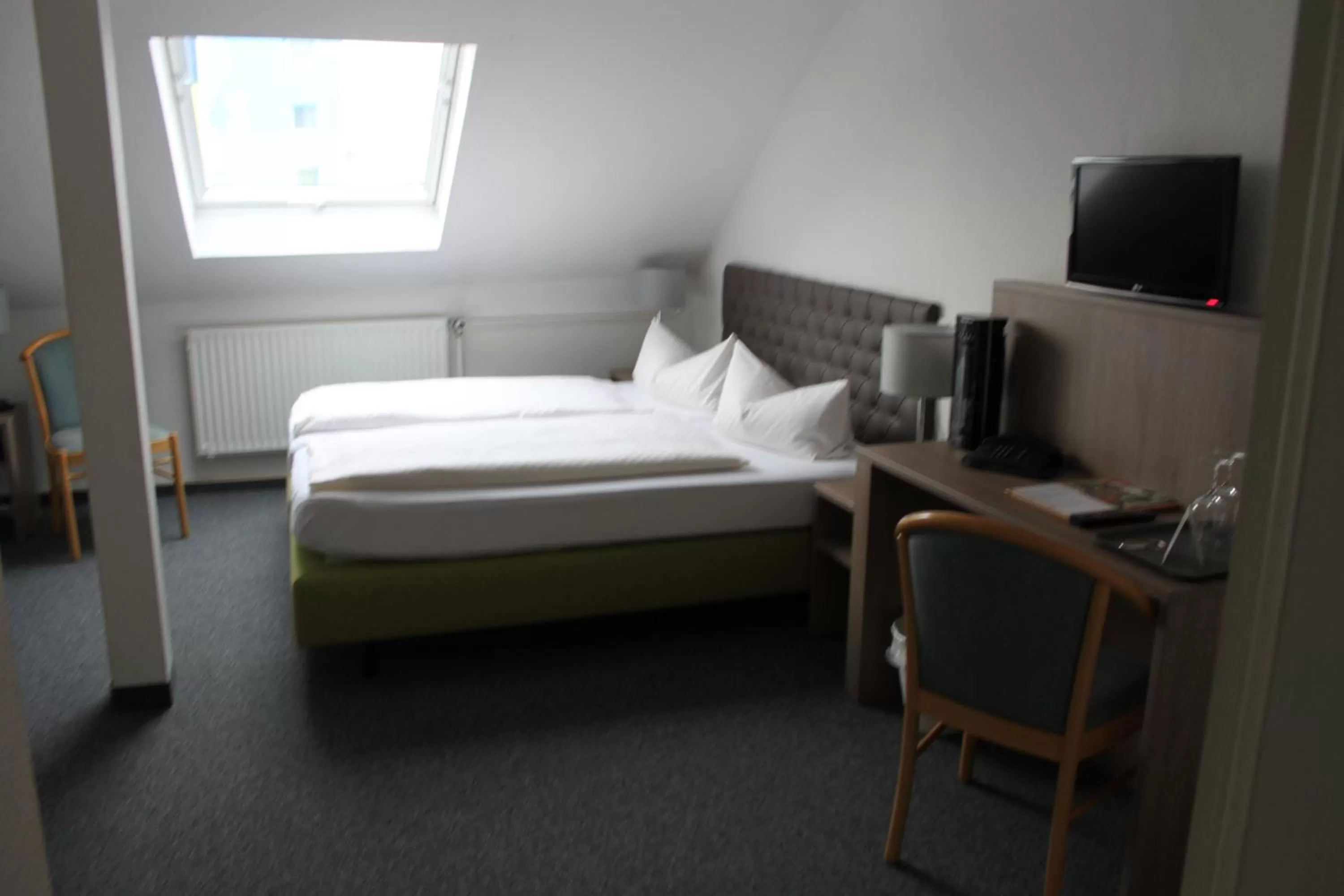 Bed in Hotel Sächsischer Hof