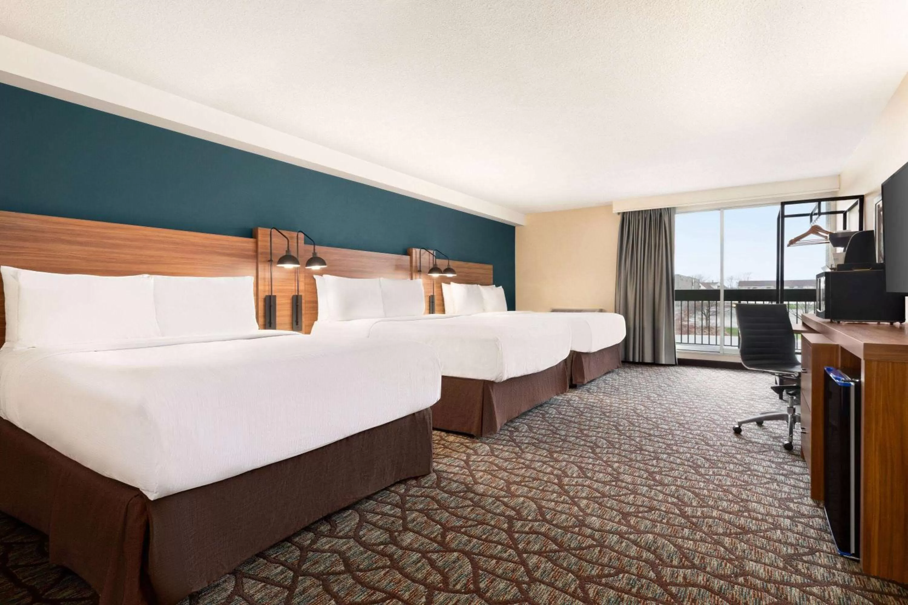 Photo of the whole room, Bed in Wyndham Garden Niagara Falls Fallsview