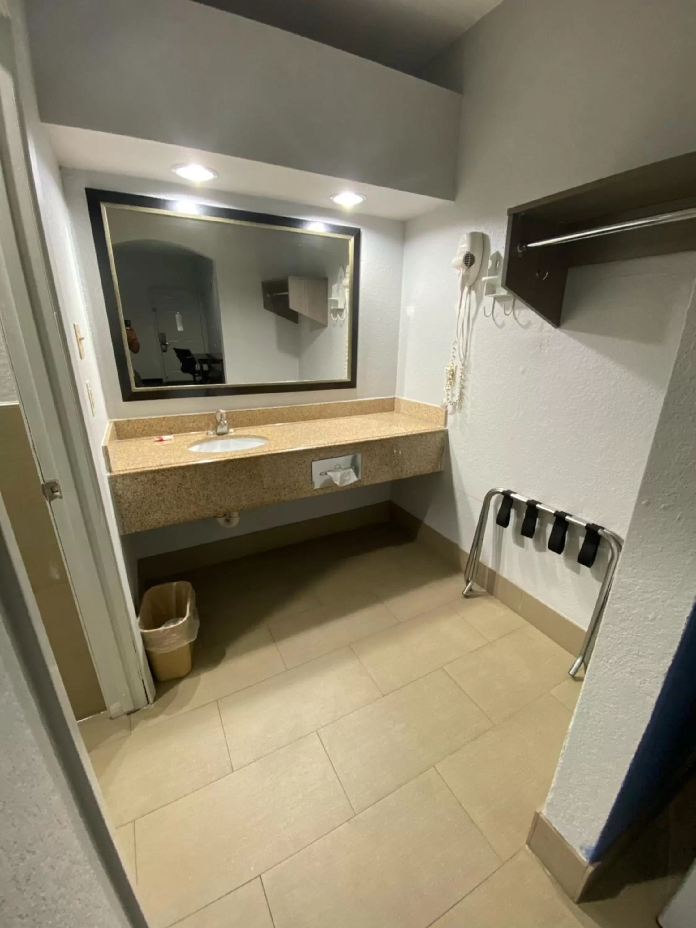 Bathroom in Super 8 by Wyndham Houston Hobby Airport South