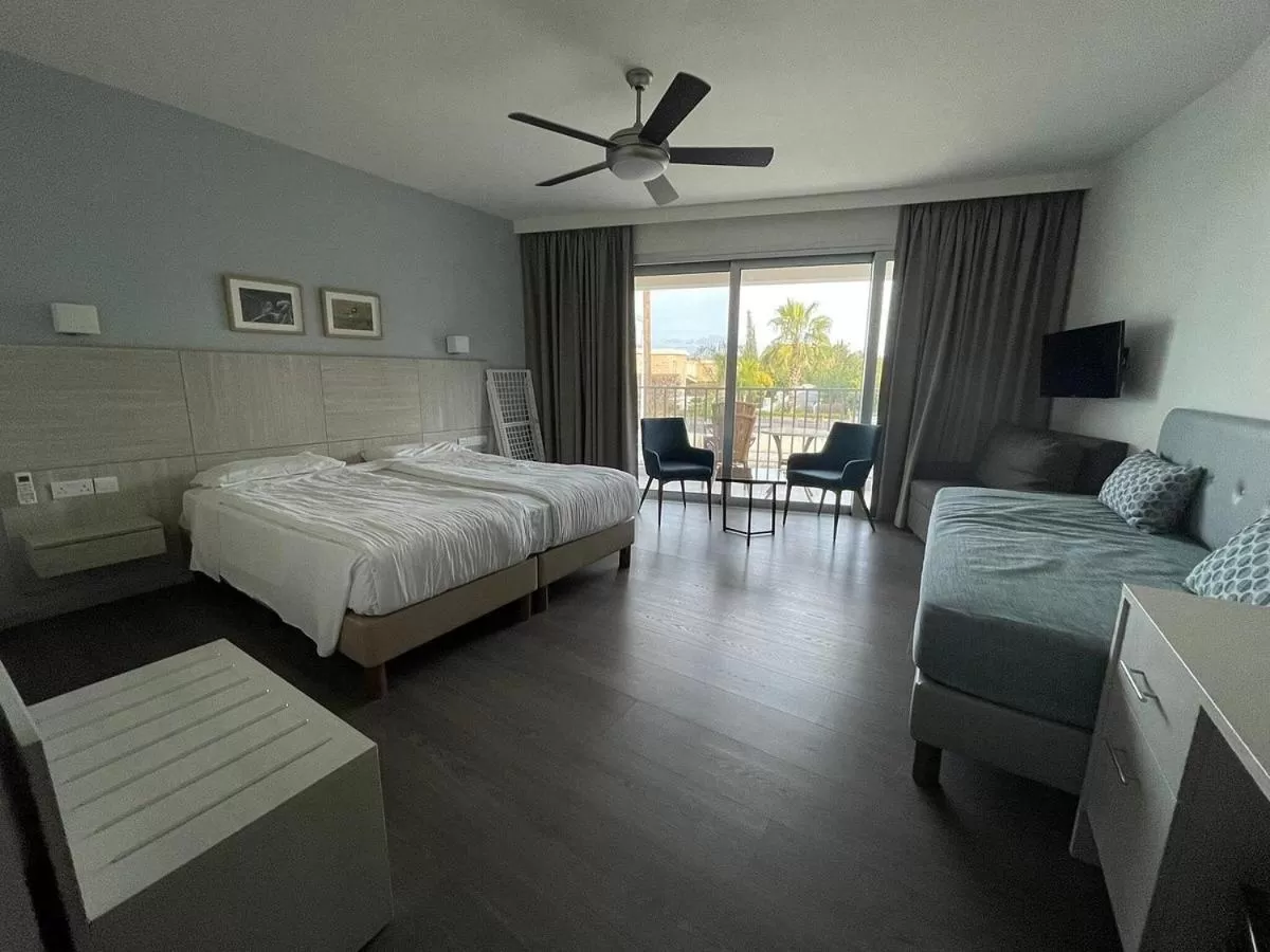 Bed in Aphrodite Beach Hotel