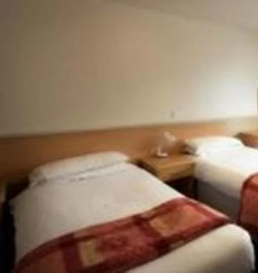 Bed in Moreton Park Hotel