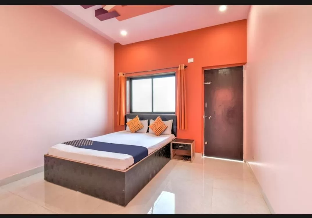 Bed in Hotel Nisarg Lodging And Restaurant