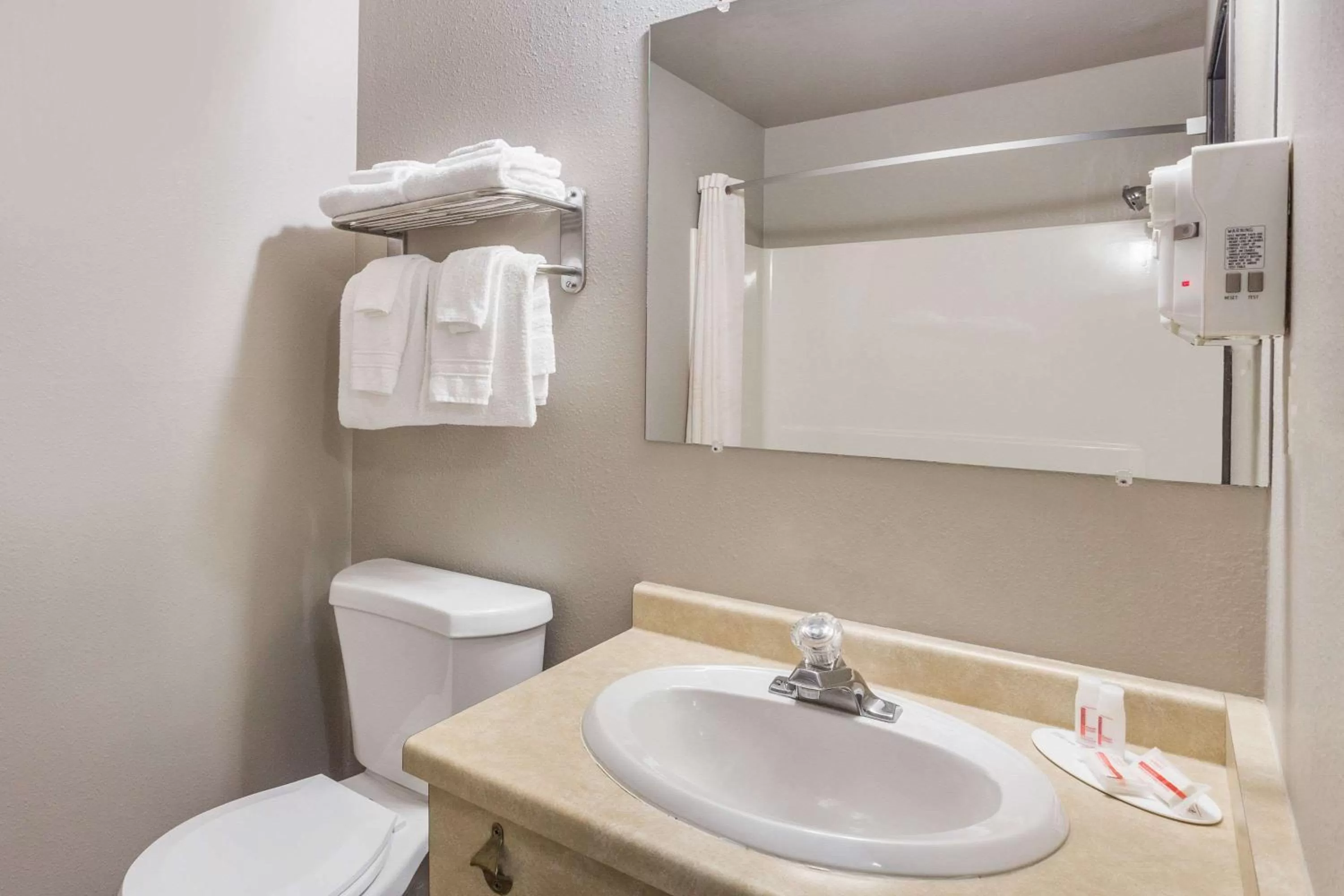 Bathroom in Super 8 by Wyndham Green Bay Near Stadium