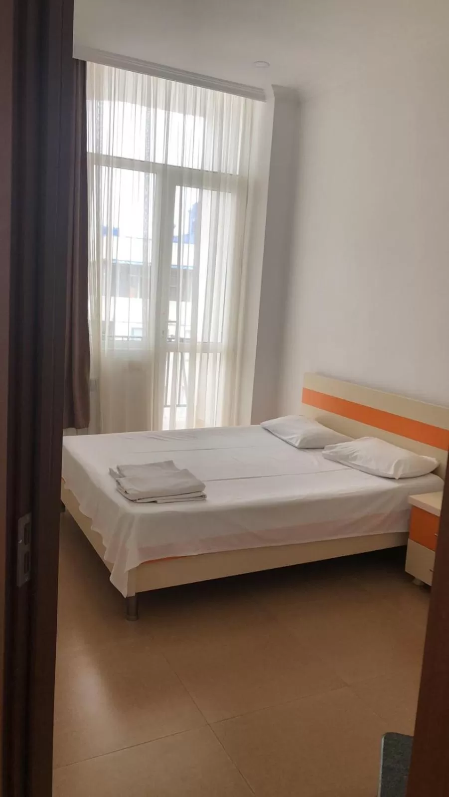 Bed in Orange Home Hotel
