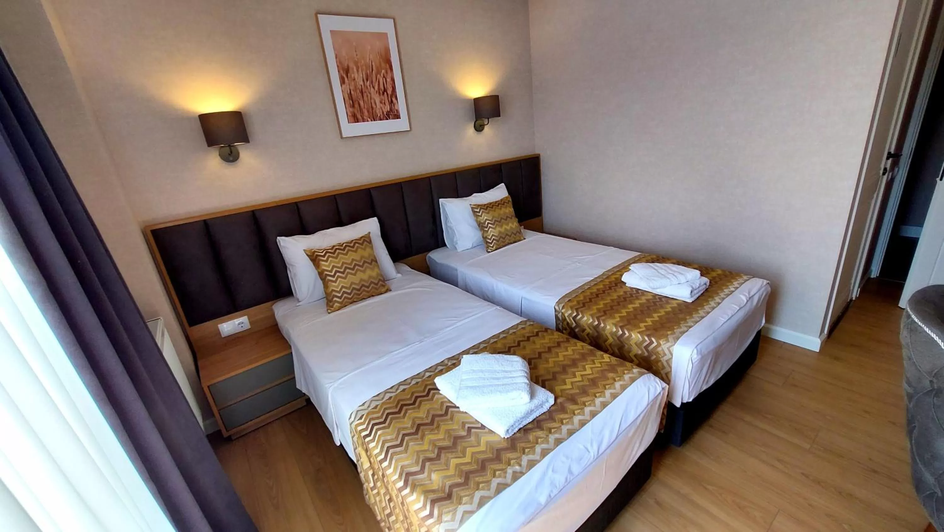 Bed in Falcon Boutique Hotel