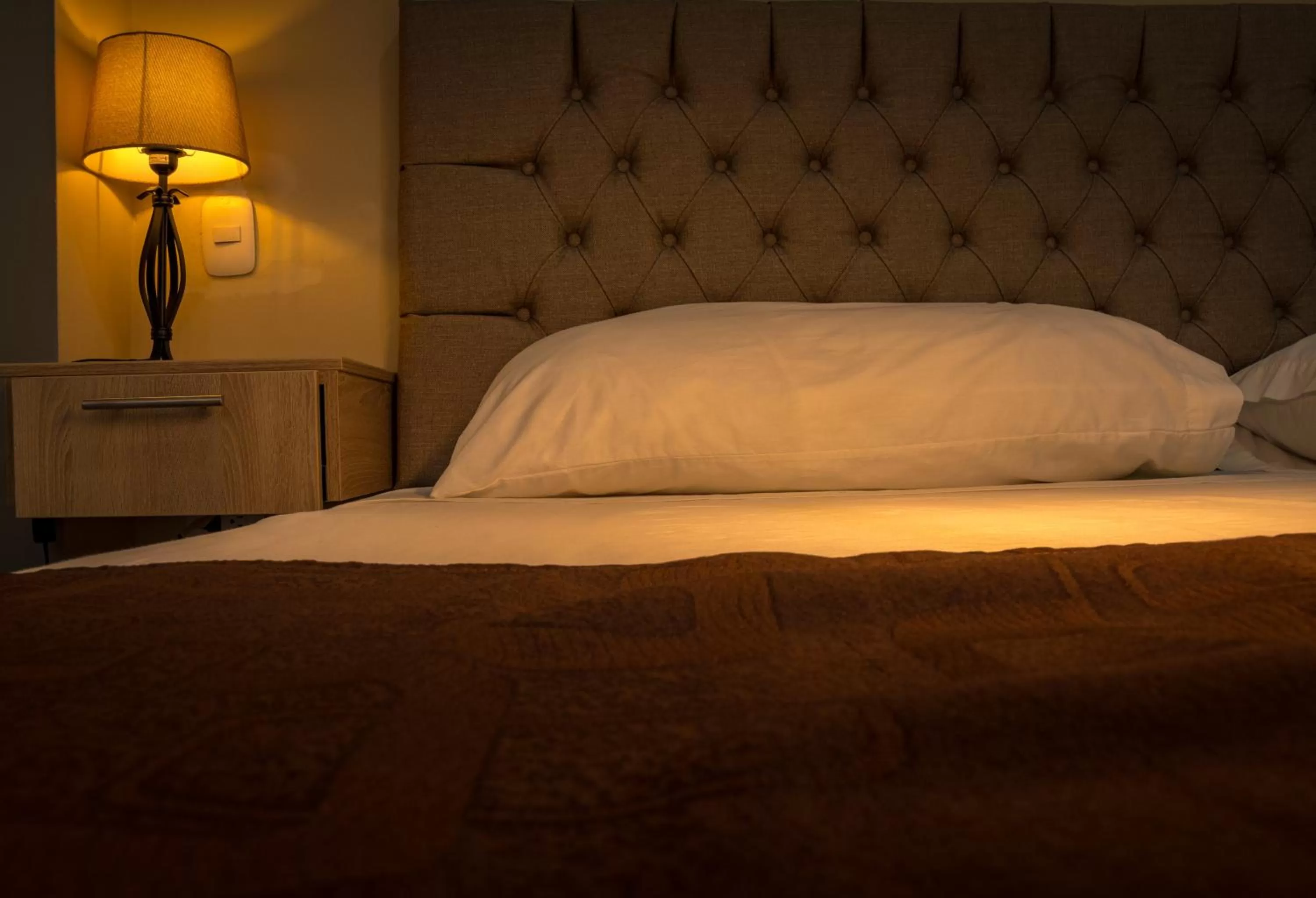 Bed in Genesis Hotel