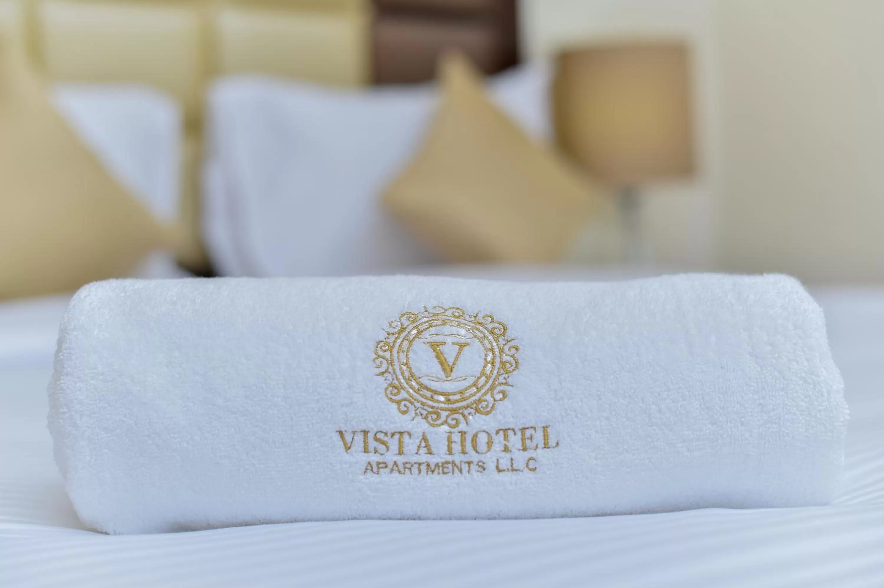 Logo/Certificate/Sign, Bed in VISTA HOTEL APARTMENTS DELUXE