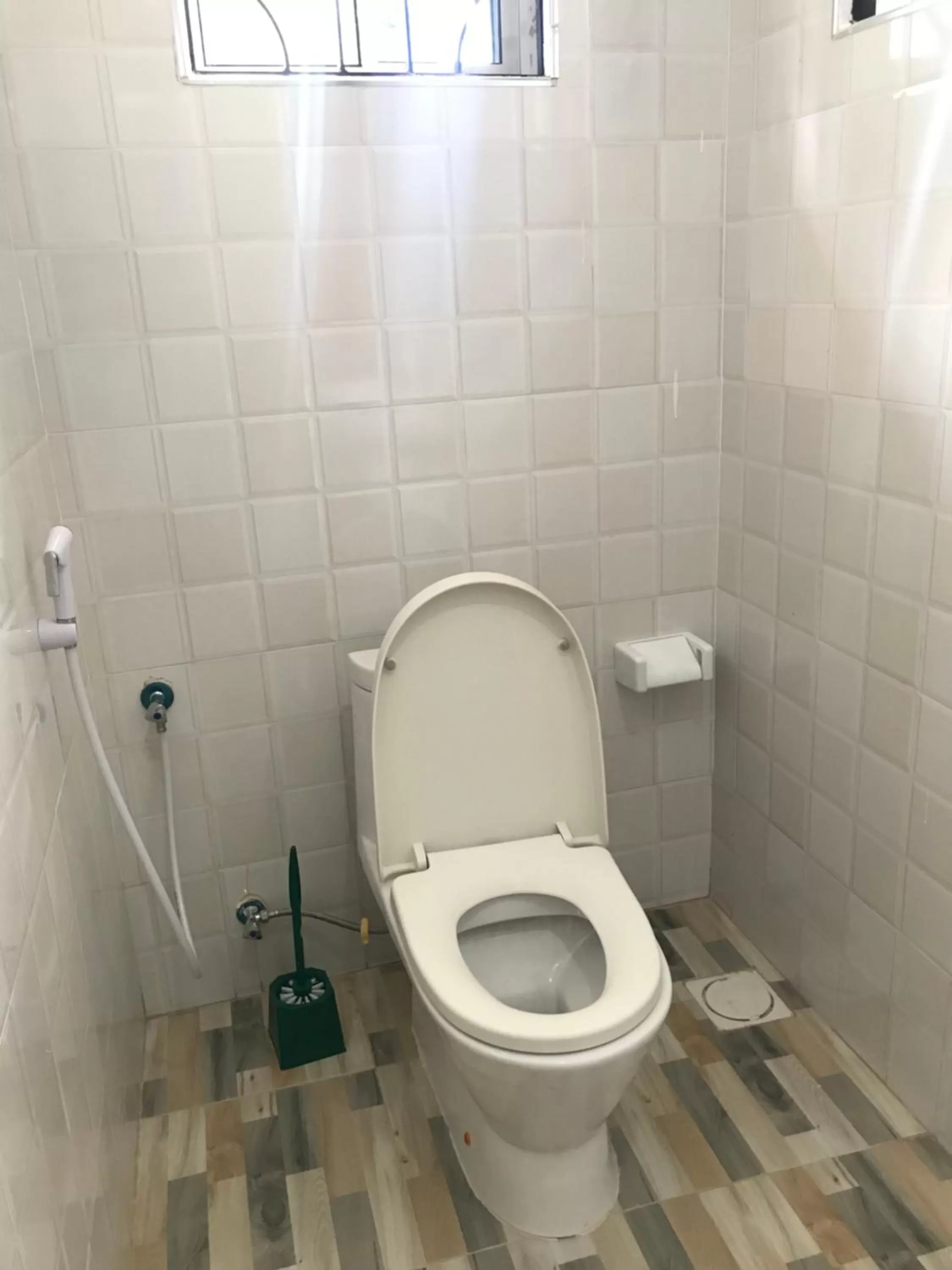 Toilet in L&J Modern Backpackers Kinondoni