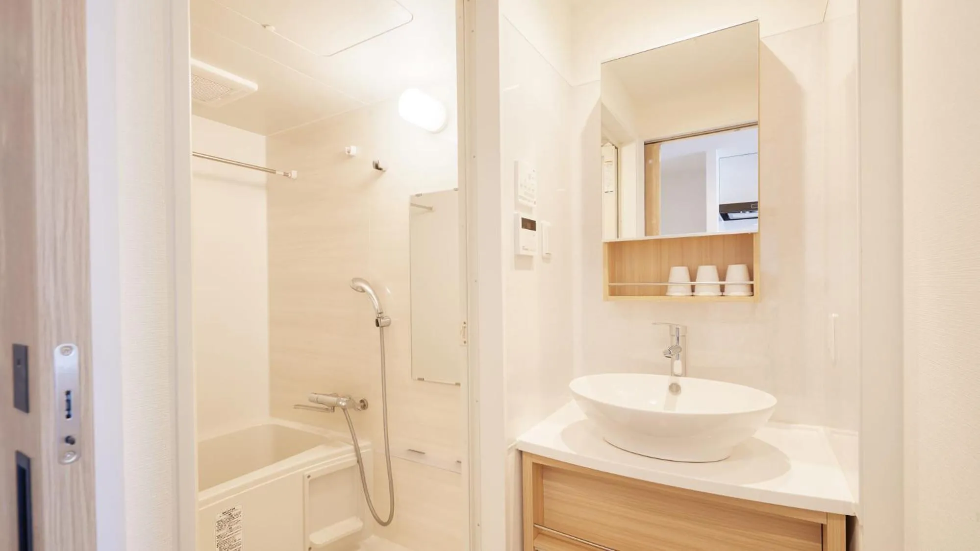 Bathroom in New Normal Hotel in NAMINOUE ニューノーマルホテルイン波の上