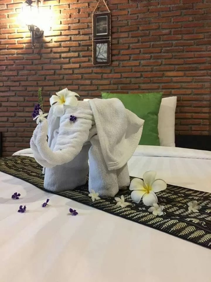 Bed in Bamboo House Resort