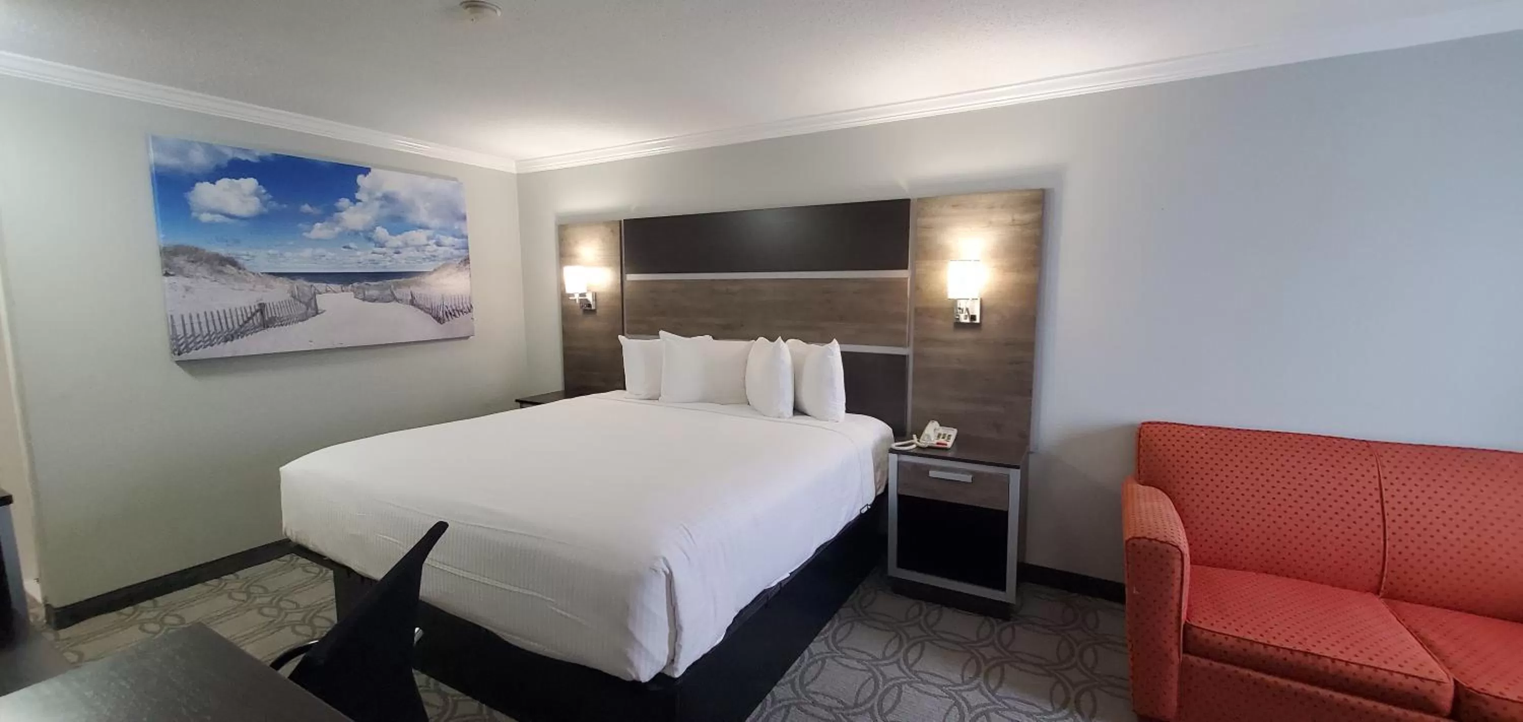 Bed in Ambassador Inn and Suites