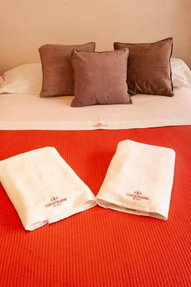 Bed in Cordoba Inn Apart Hotel