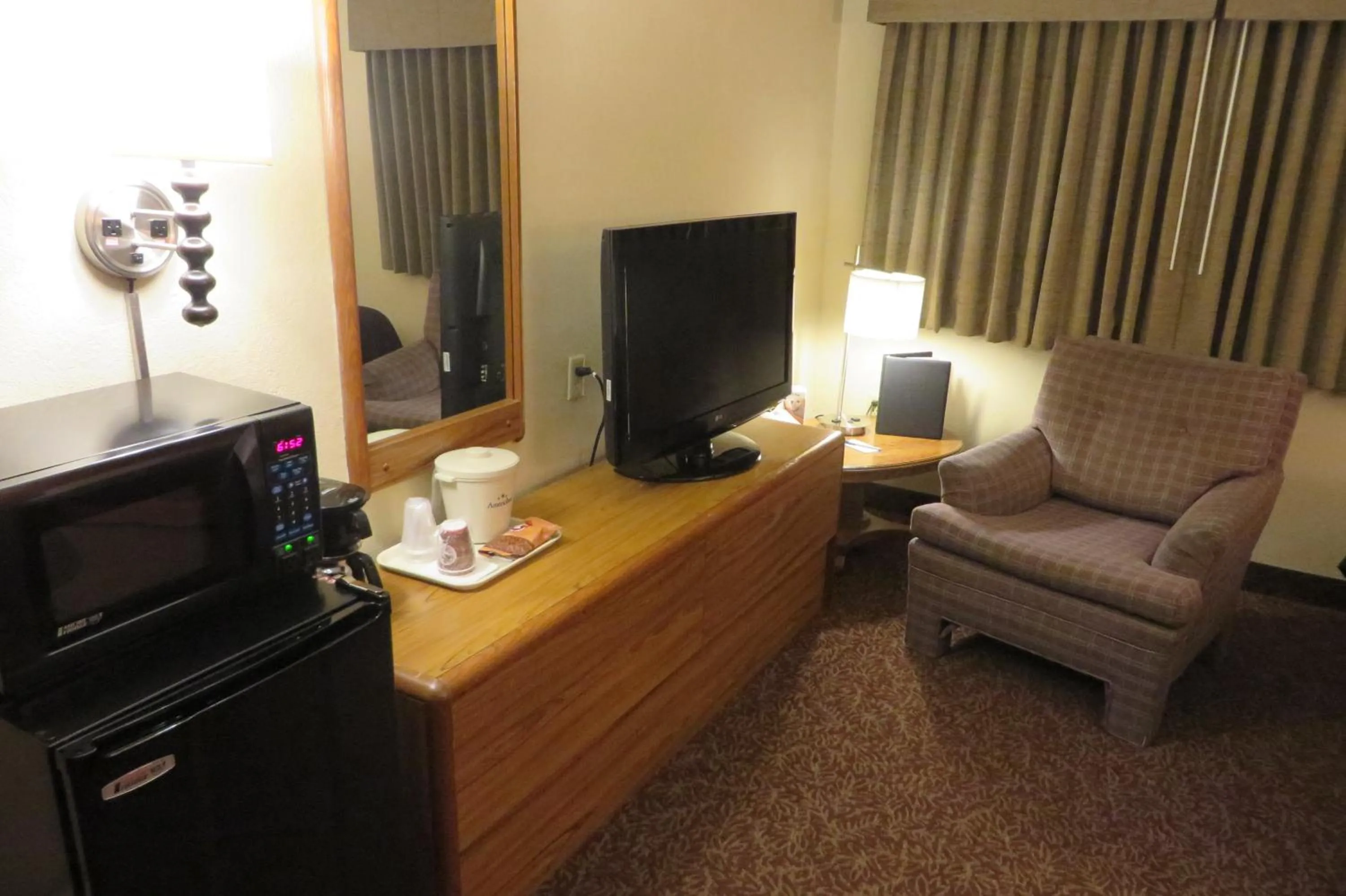 TV and multimedia in AmericInn by Wyndham Forest Lake