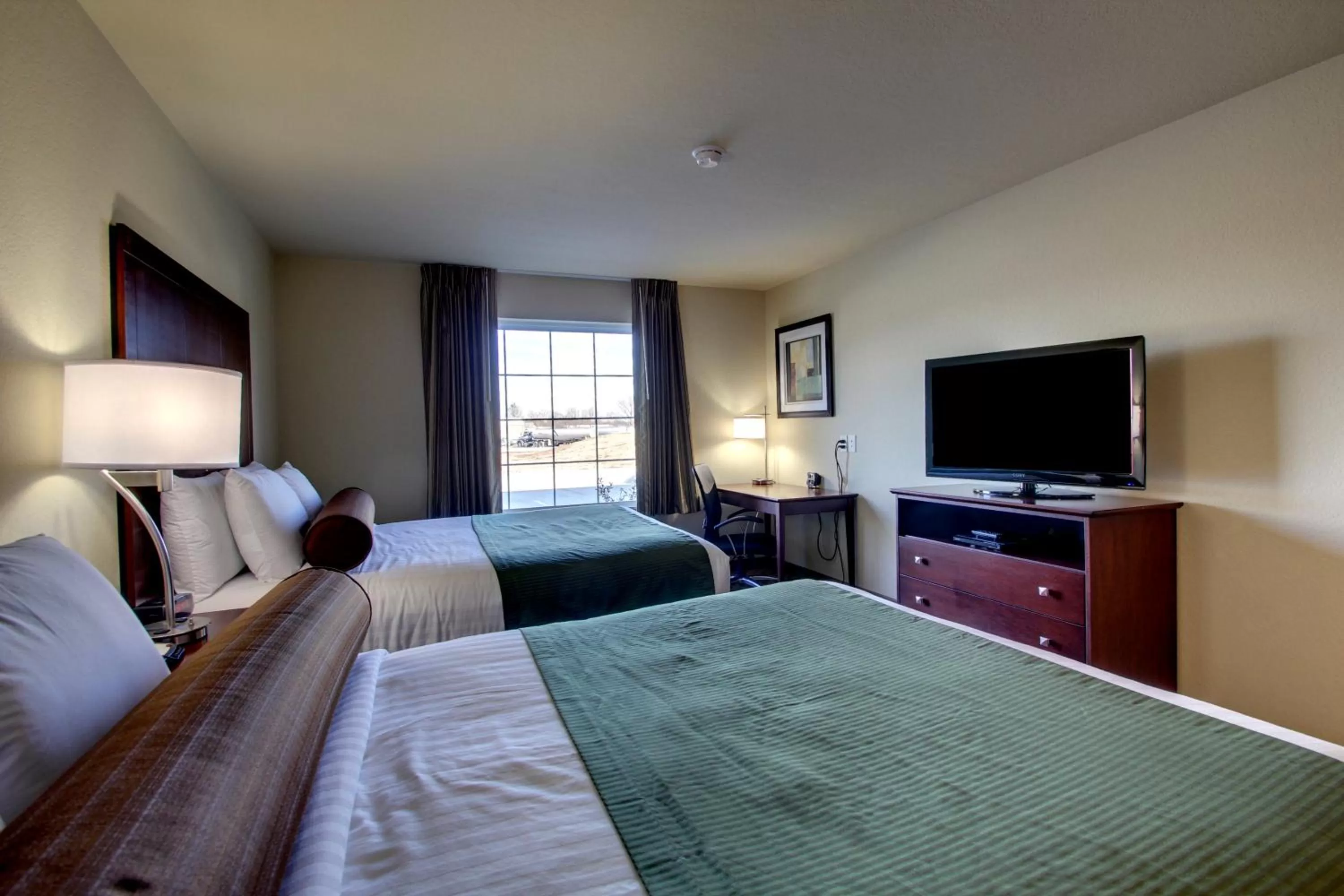 Bed in Cobblestone Inn & Suites - Rugby