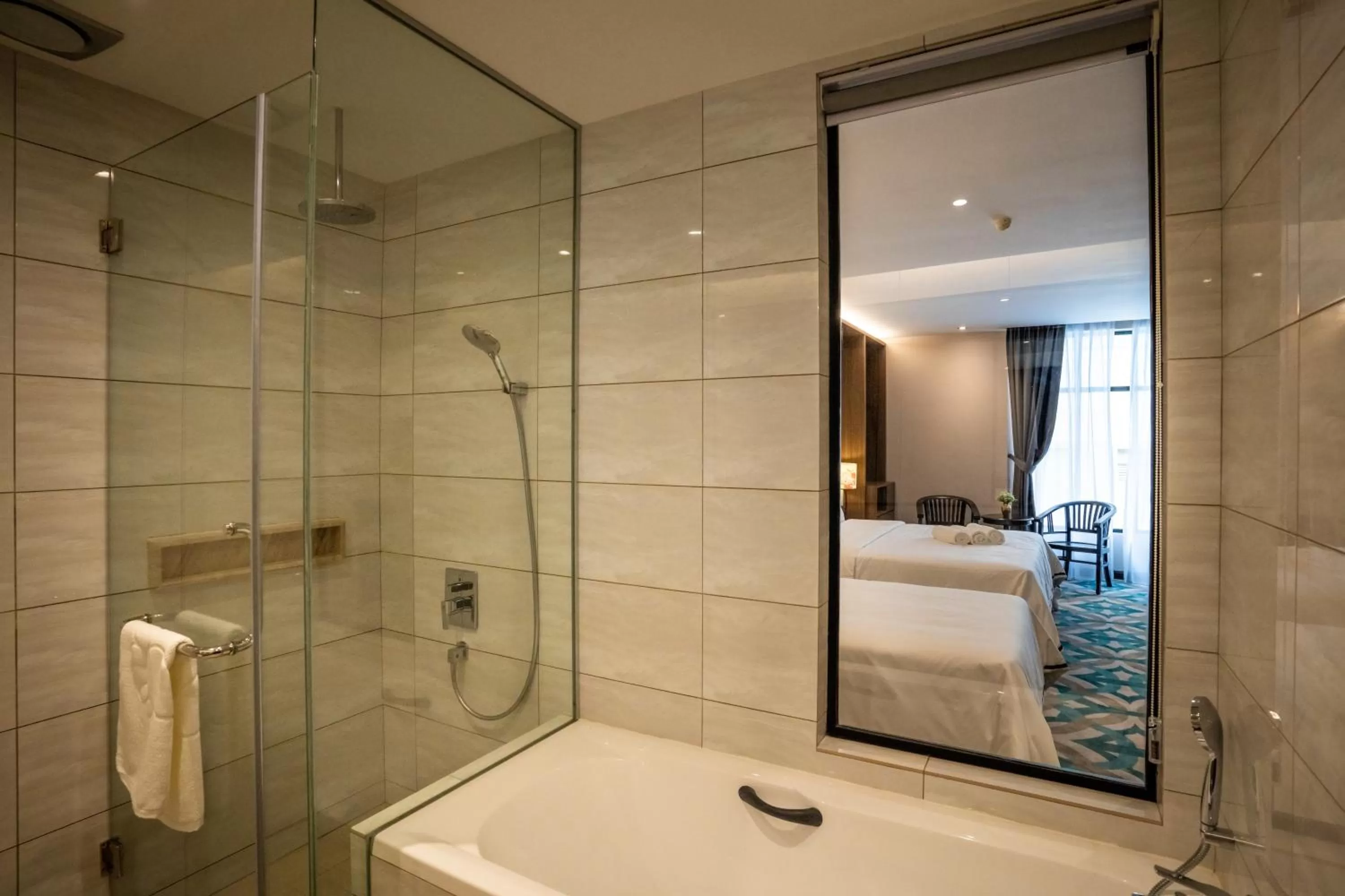 Bed in CHRISTEE SUITES HOTEL