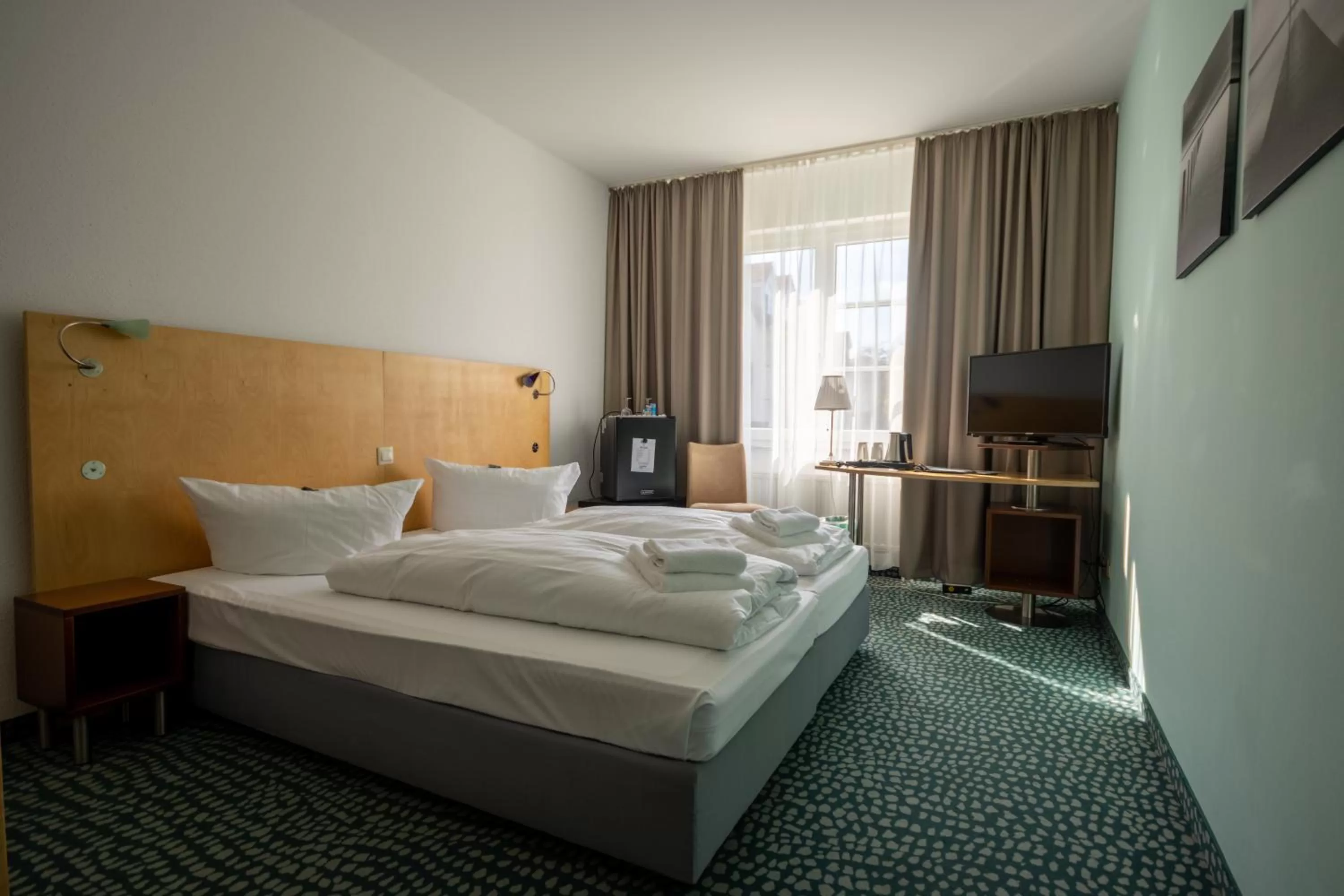 Bed in Check Inn Hotel Merseburg