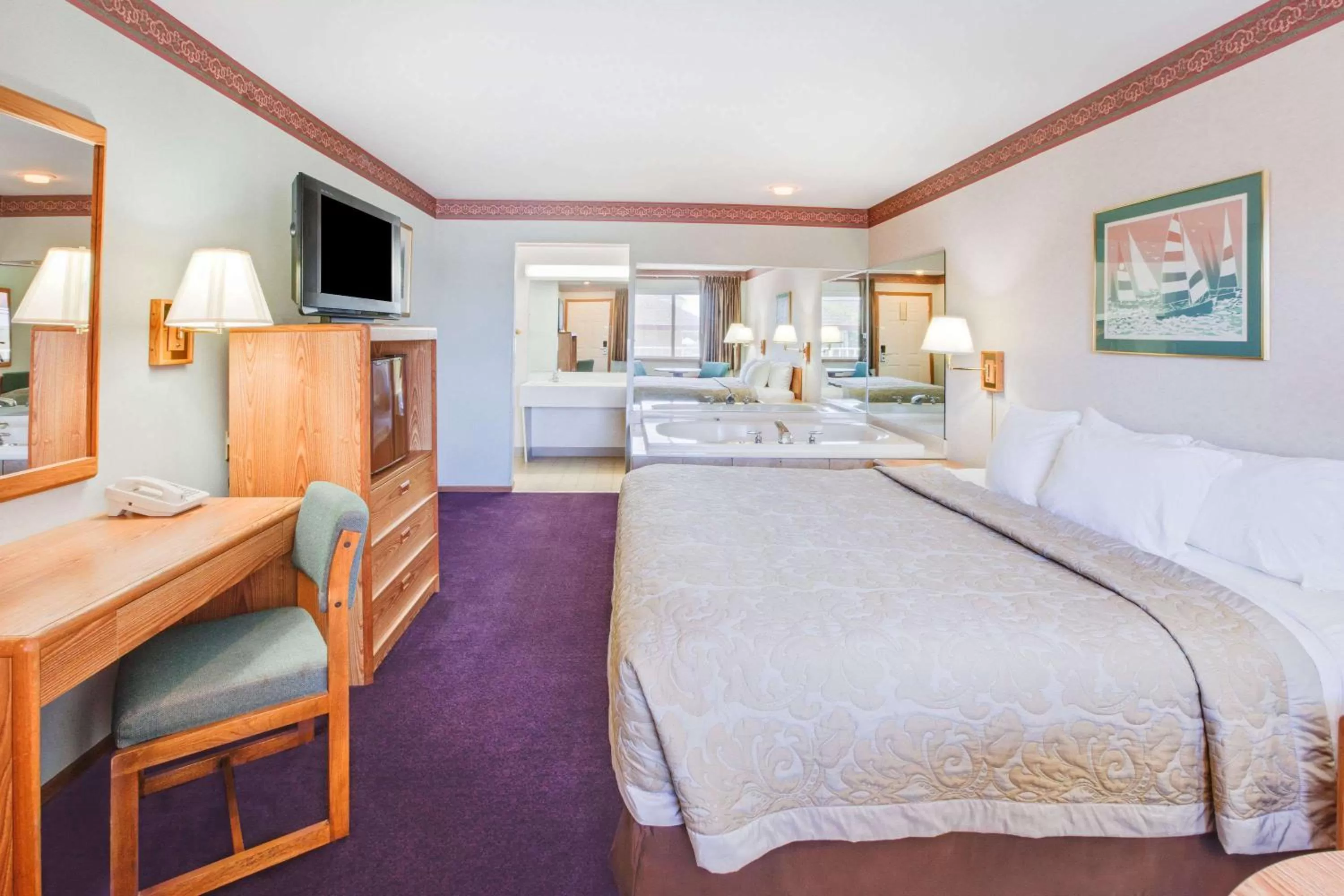 Photo of the whole room, Bed in Super 8 Beachfront by Wyndham Mackinaw City, MI