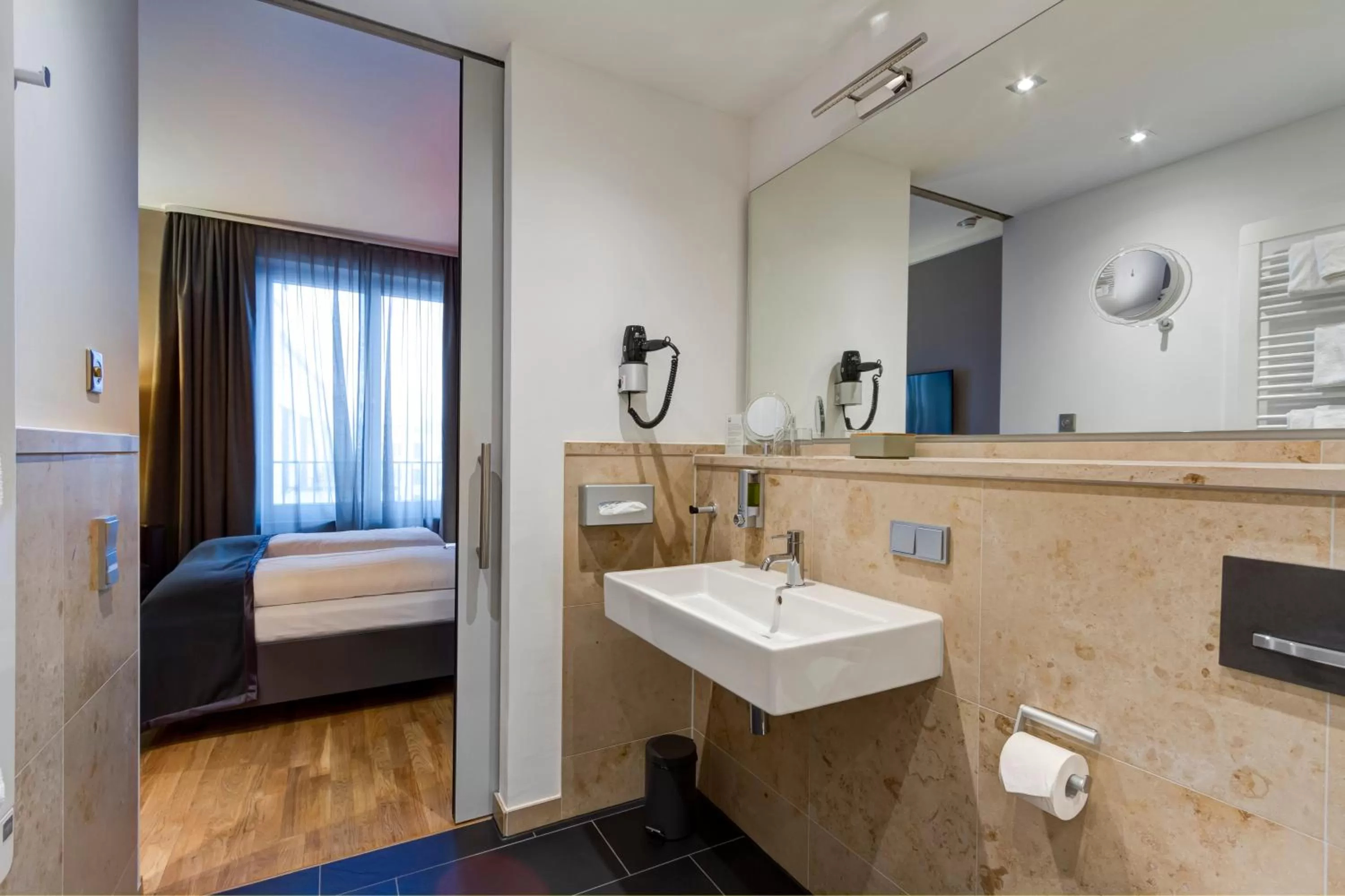 Bathroom, Bed in Qube Hotel Bahnstadt