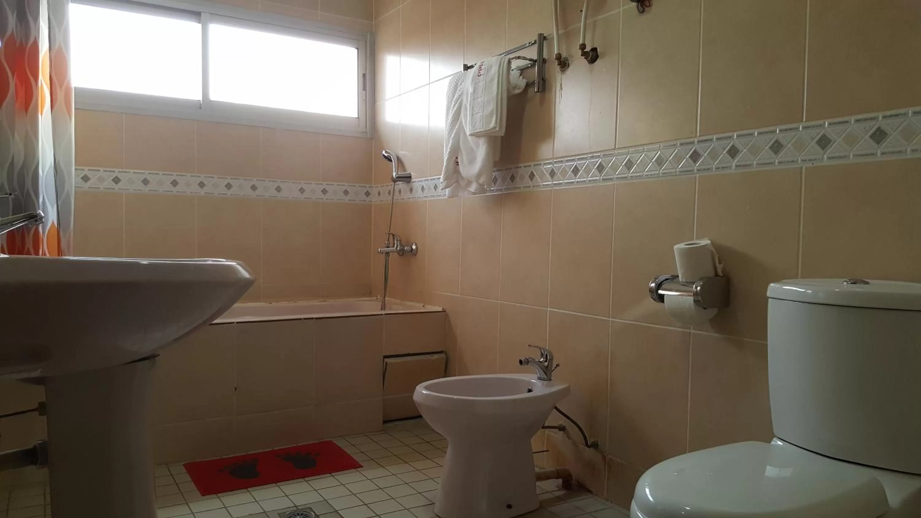 Bathroom in Peninsula Hotel Douala