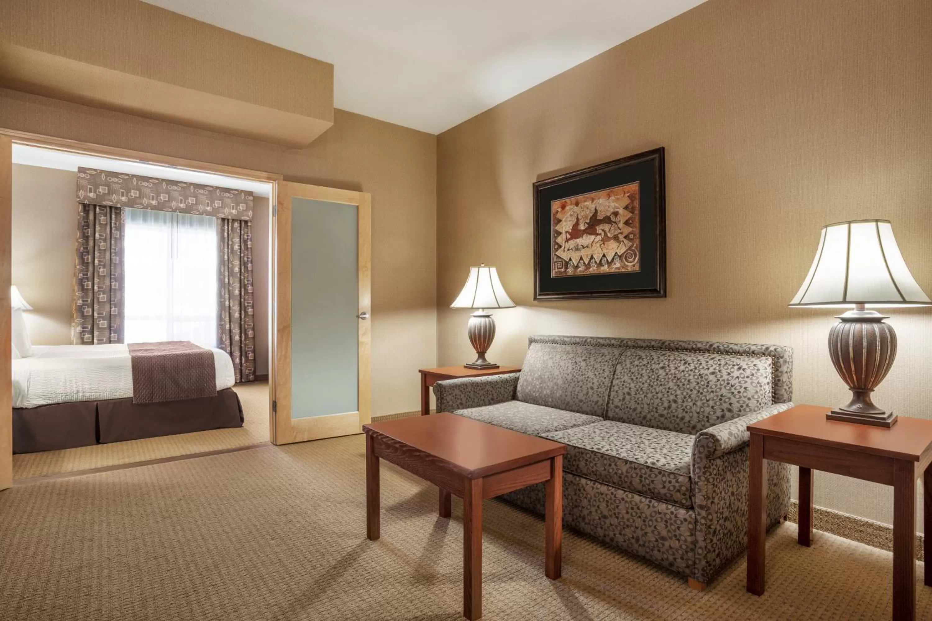 Living room, Bed in Days Inn & Suites by Wyndham Strathmore