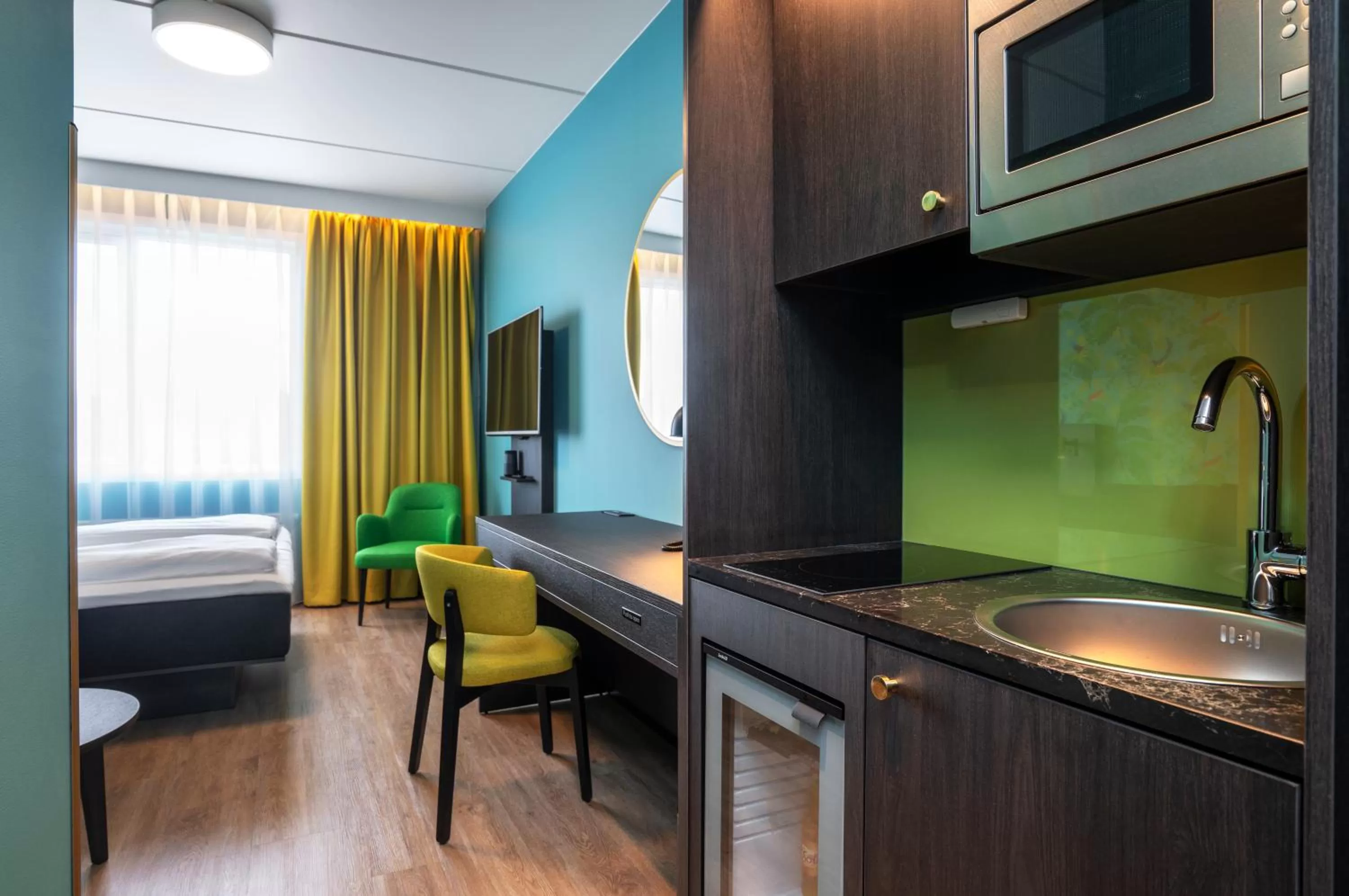 Kitchen or kitchenette, Bed in Thon Hotel Alta