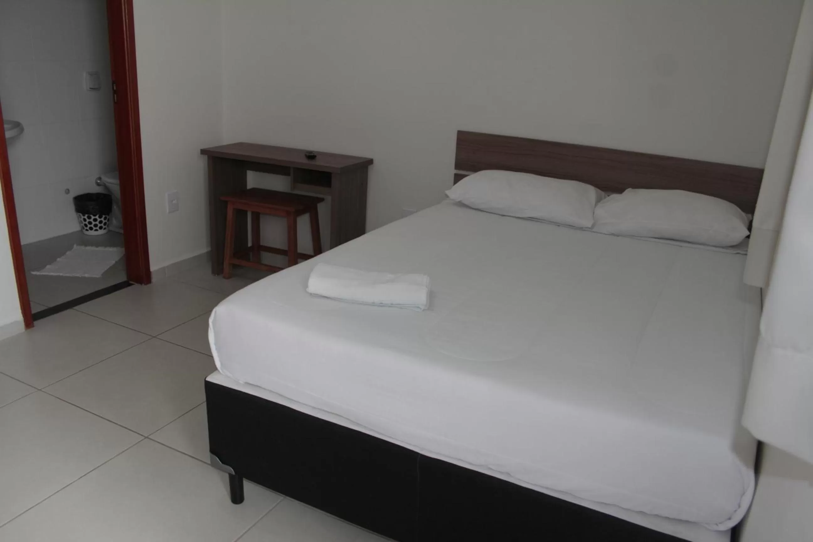 Bed in Leati's Hotel