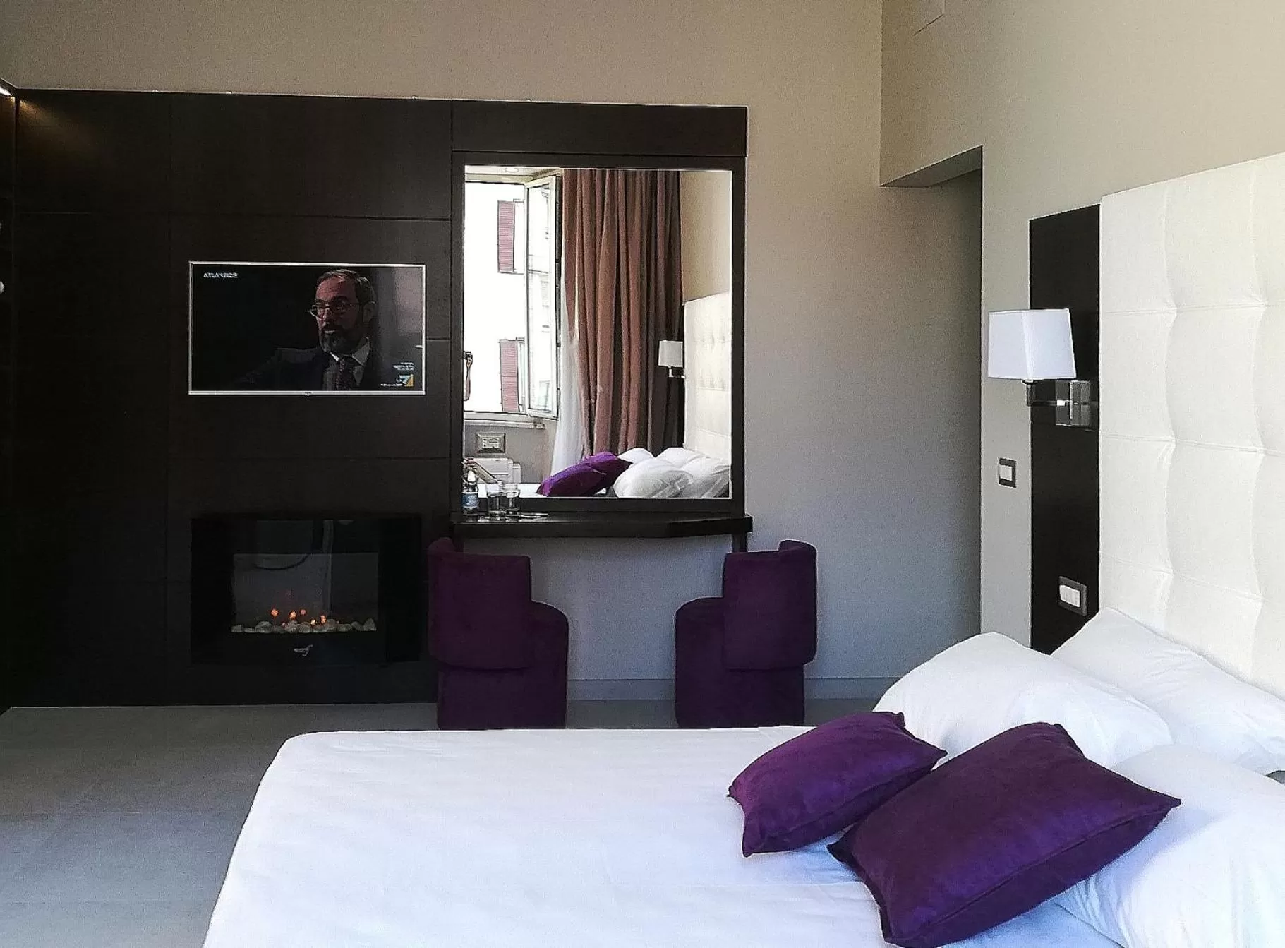 Bed in Roman Holidays Boutique Hotel