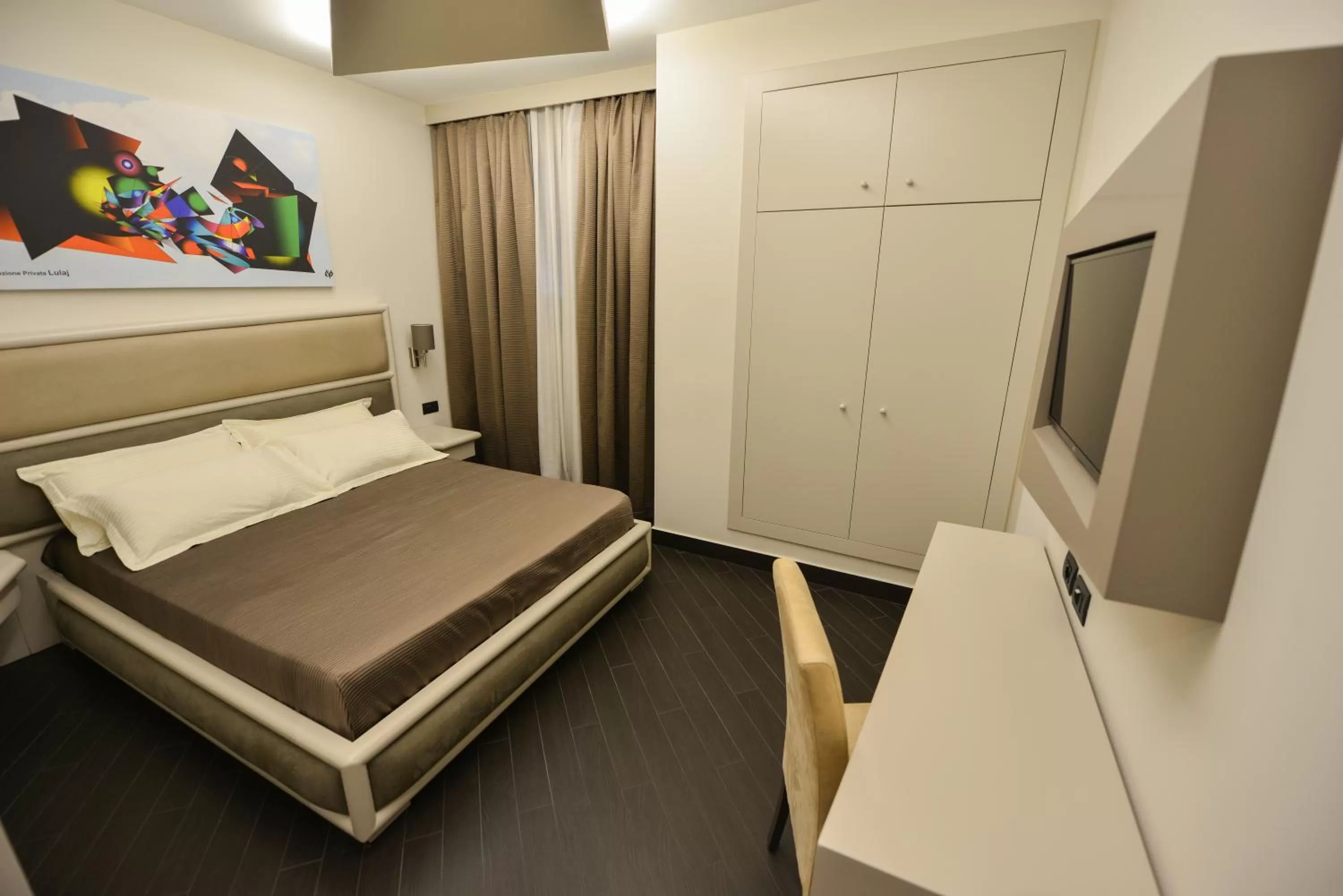 Bed in Petit Hotel Elita