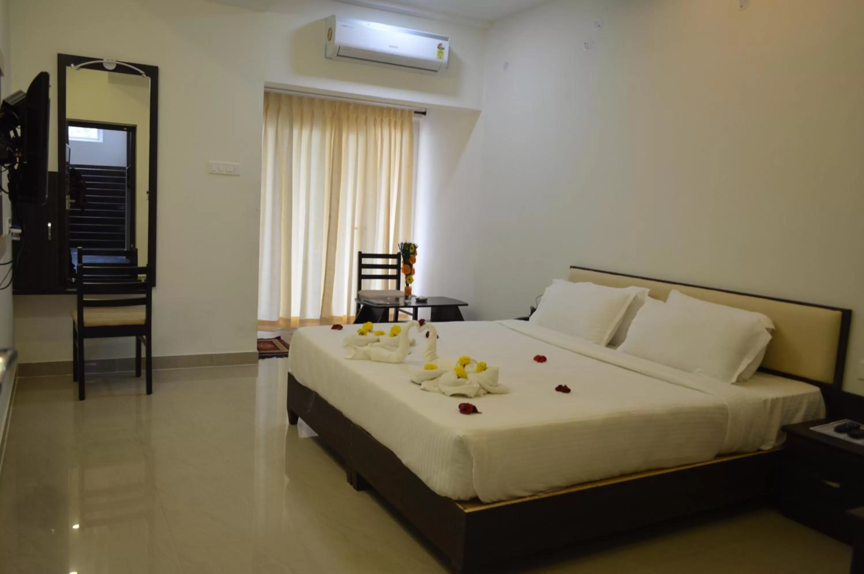 Bed in Hotel Ambai Grand