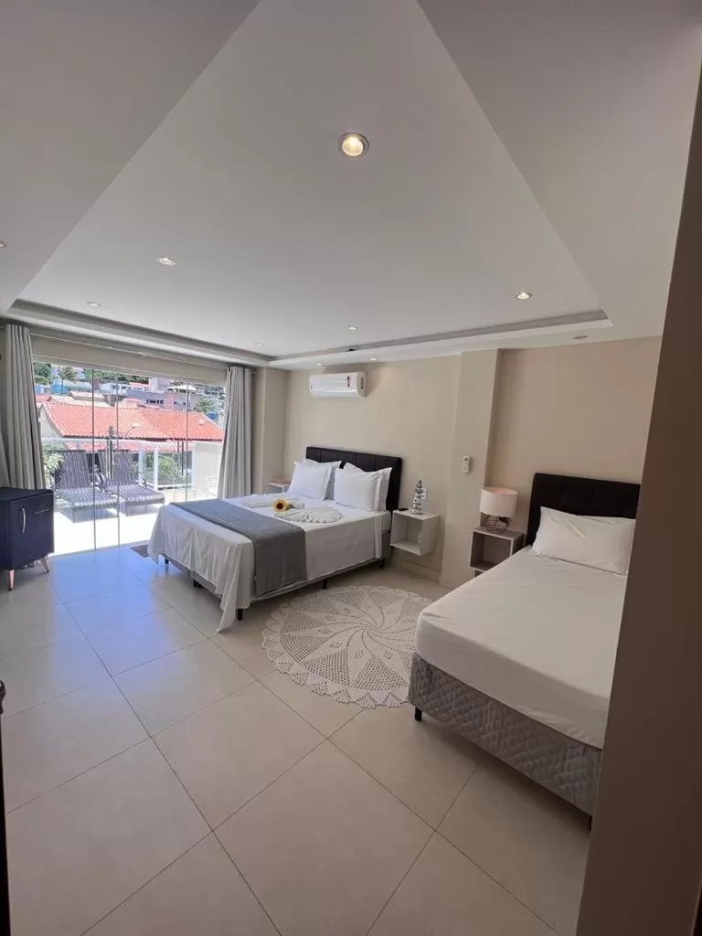 Bed in Pousada Arraial Tropical