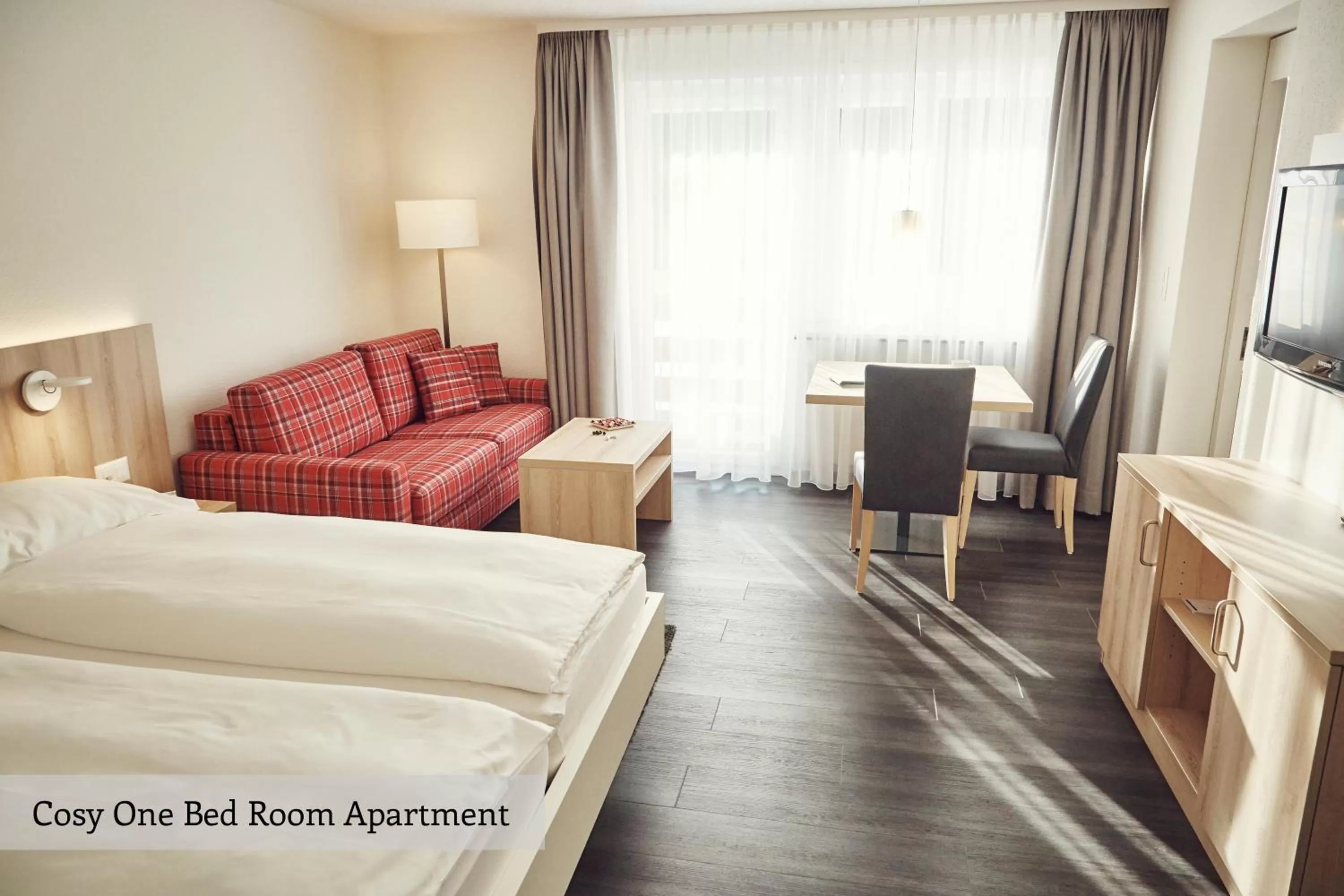 Seating area, Bed in Serviced Apartments by Solaria