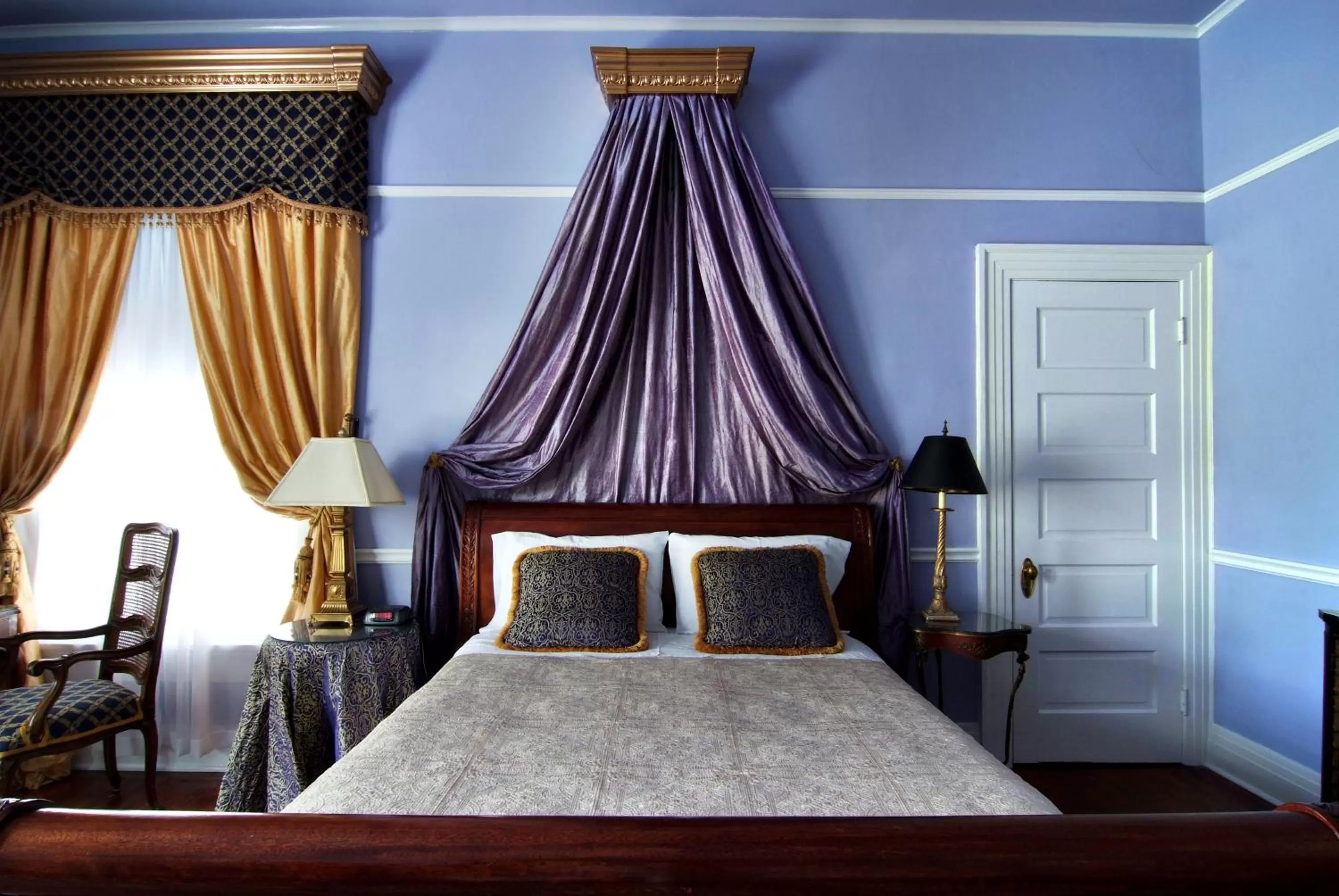 Bed in Historic Michabelle Inn